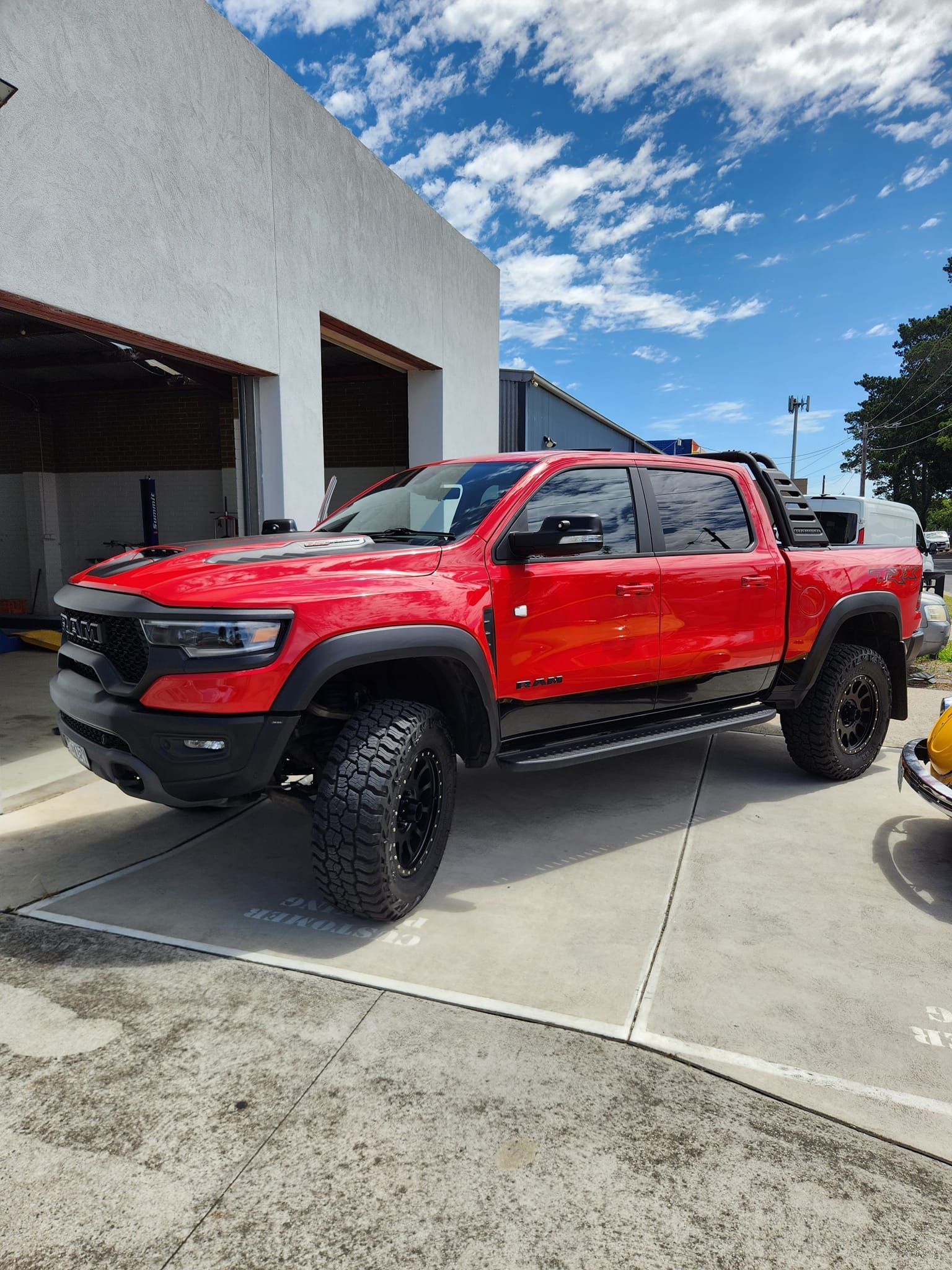 Red Ram TRX truck parked in front of a building on a sunny day. — COOTA Automotive Services in Ballarat East, VIC