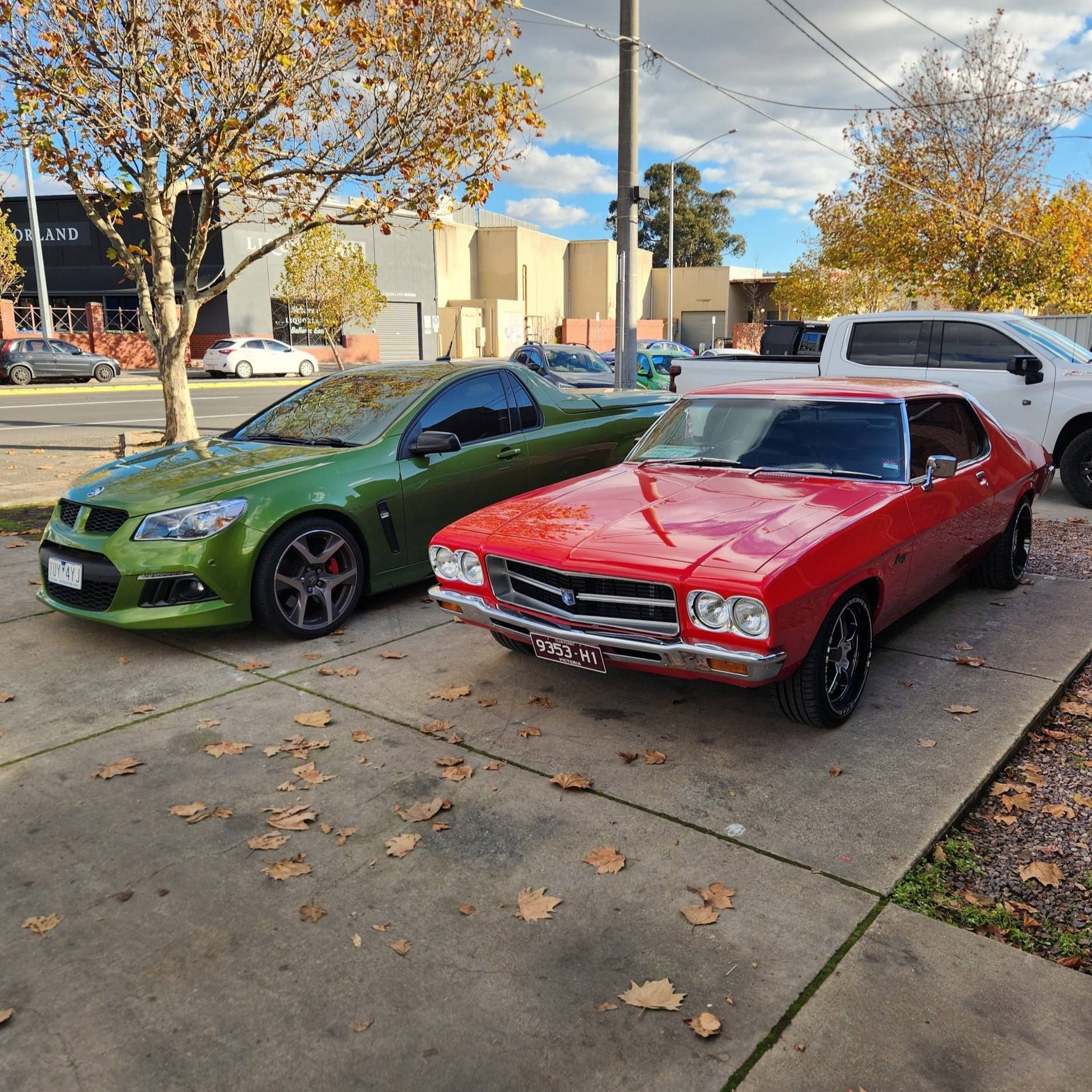 Green and Red Holden Cars Parked on a Paved Lot — COOTA Automotive Services in Ballarat East, VIC