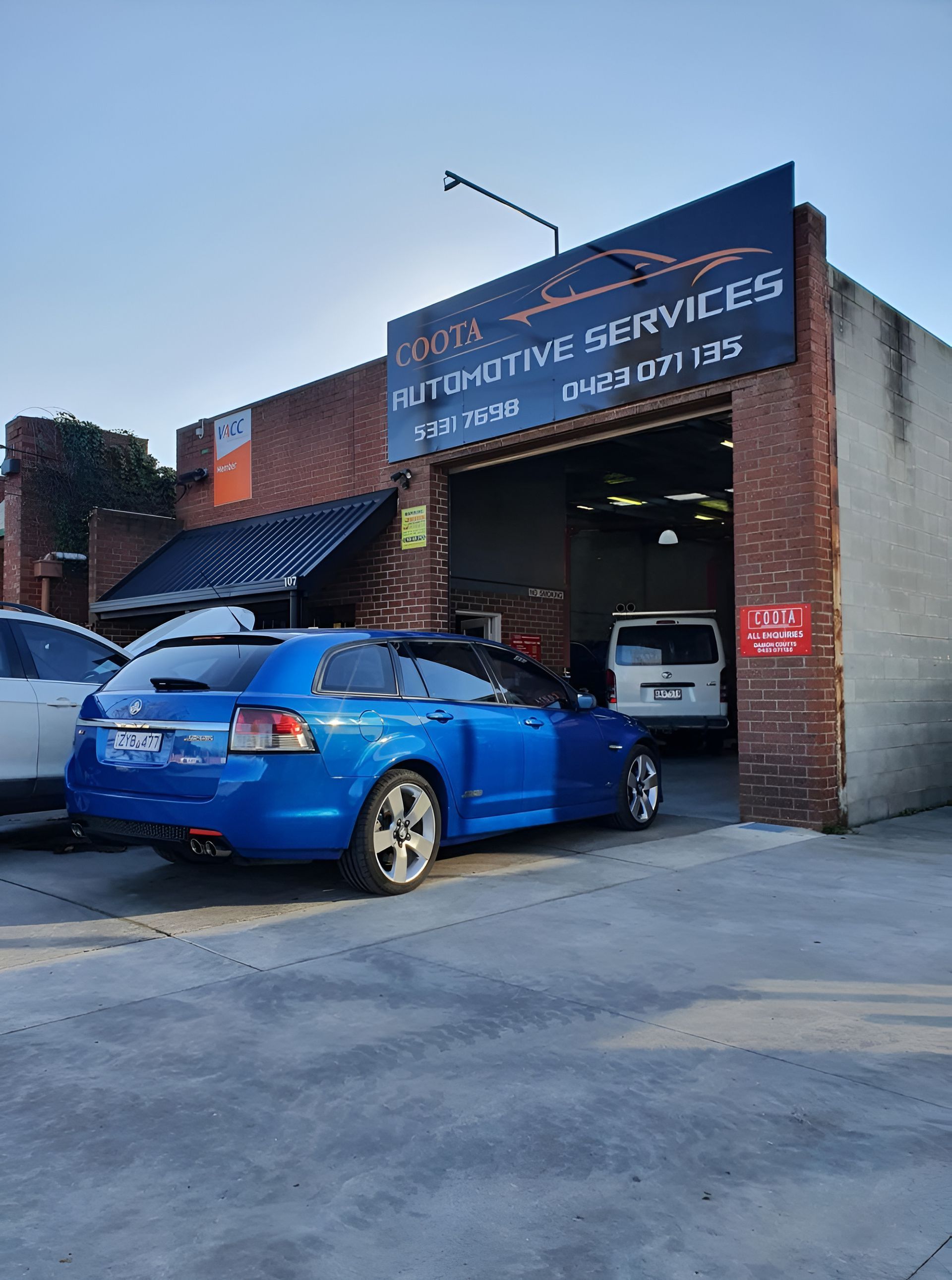 Blue Car Parked in Front of Garage — COOTA Automotive Services in Ballarat East, VIC