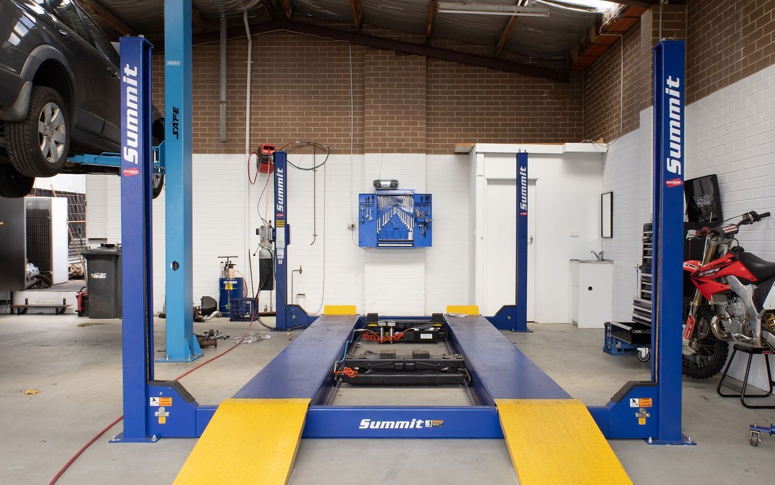 Car Lift in a Garage — COOTA Automotive Services in Ballarat East, VIC