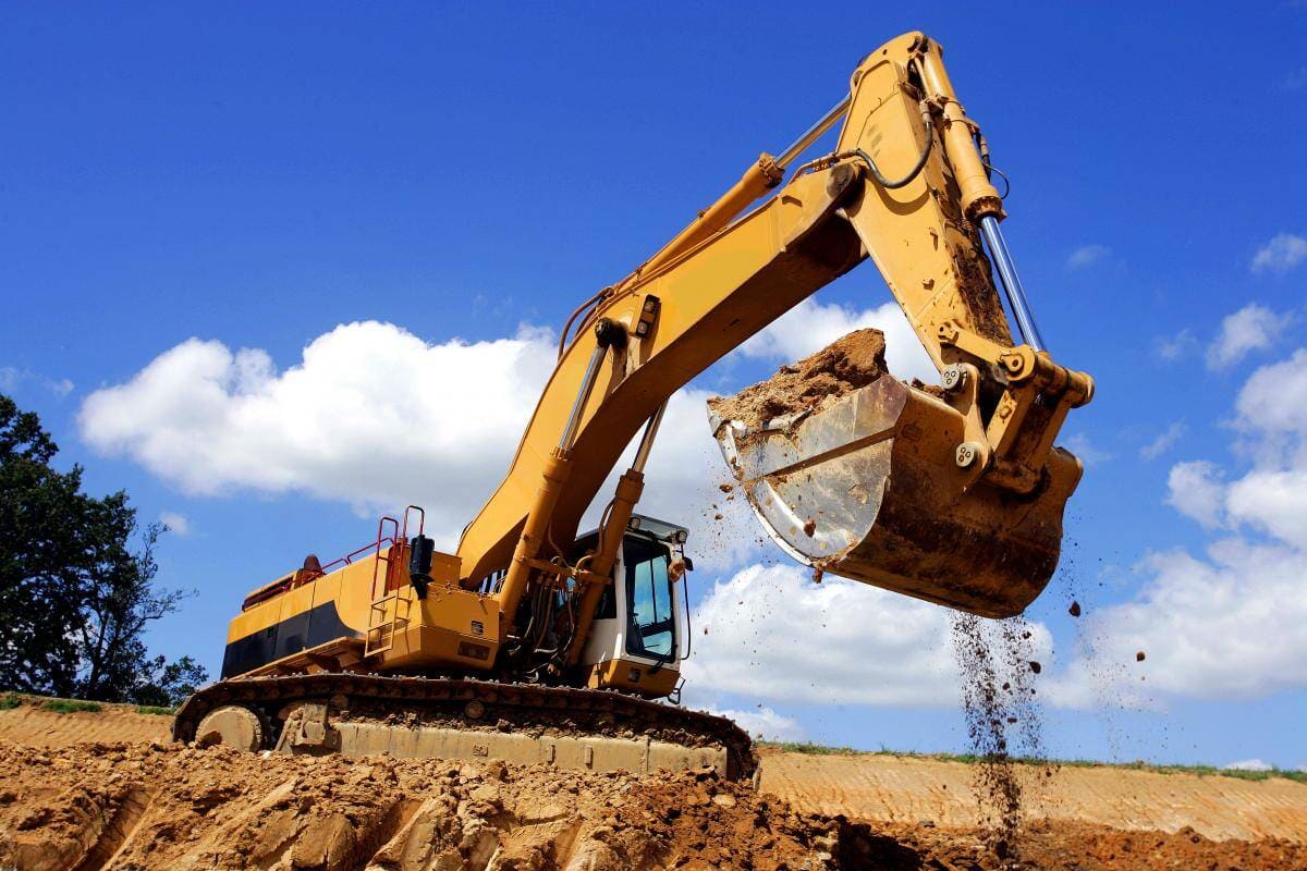 Excavator1, blue sky background — Excavation in Glass House Mountains, QLD