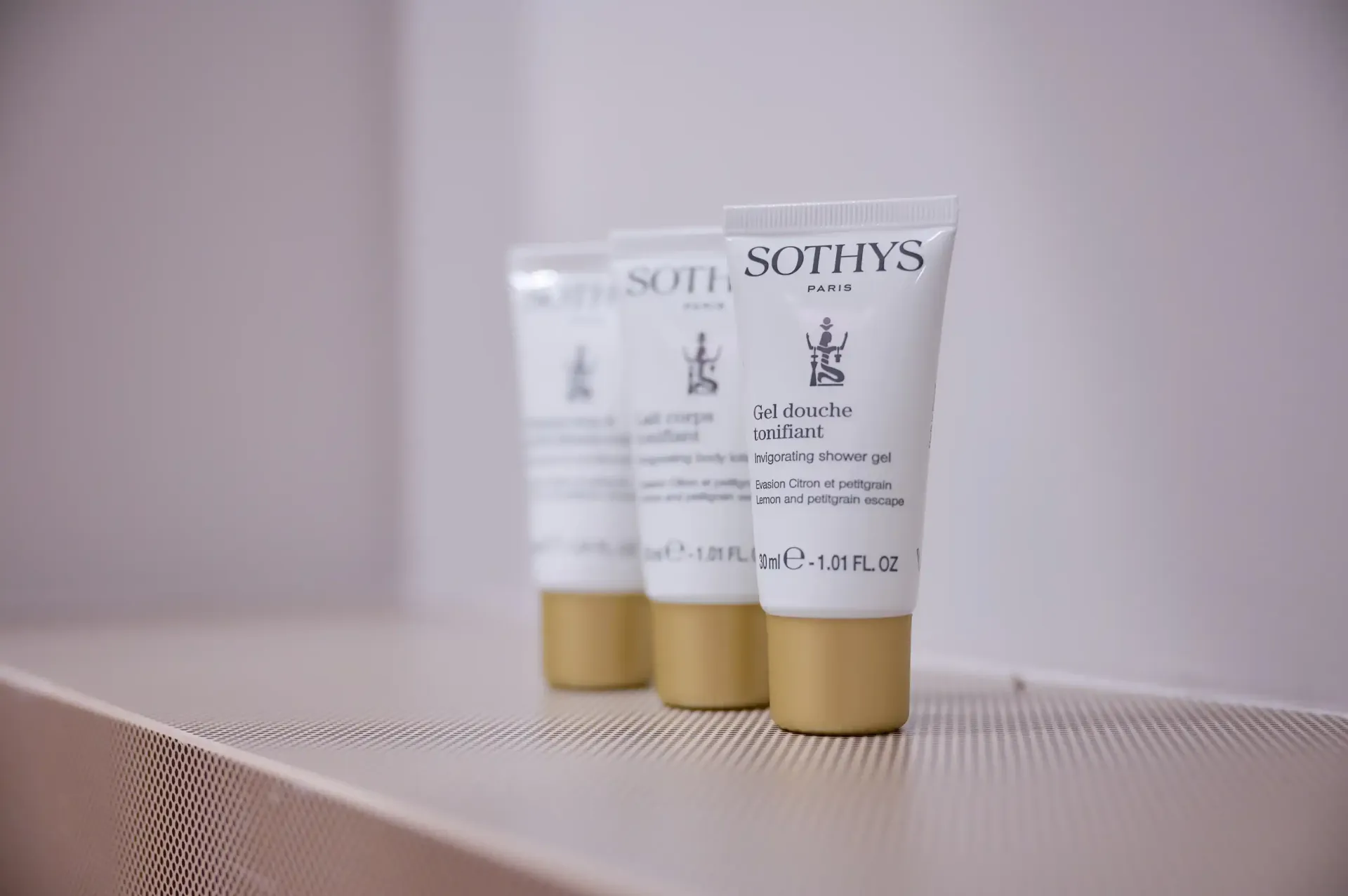 Three tubes of sothys lotion are lined up on a table.
