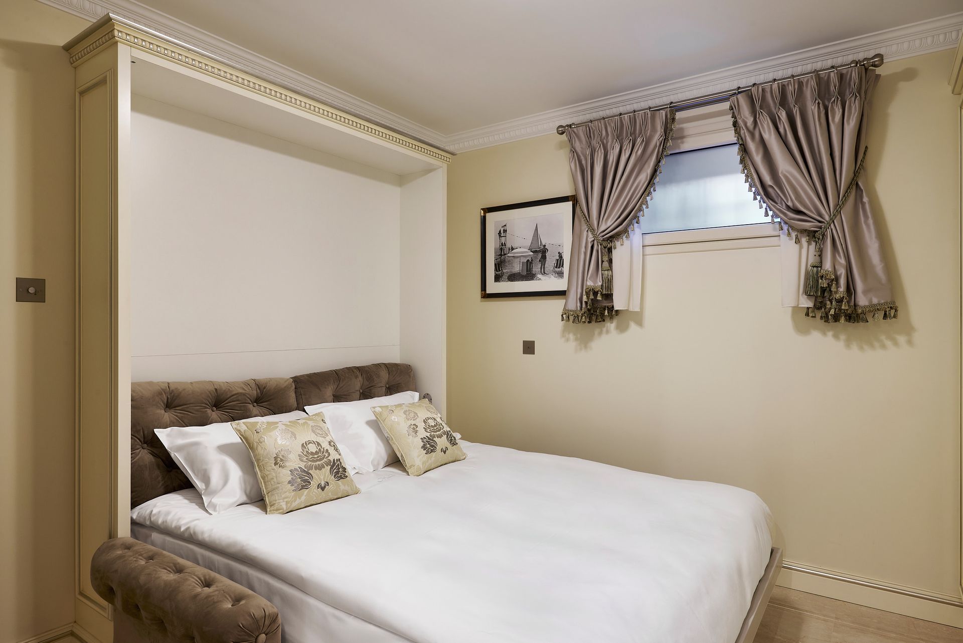 A hotel room with a bed and a television.