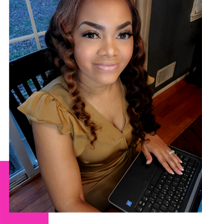 A Woman Is Sitting in A Chair Using a Laptop Computer - Knoxville, TN - Slay By Rae