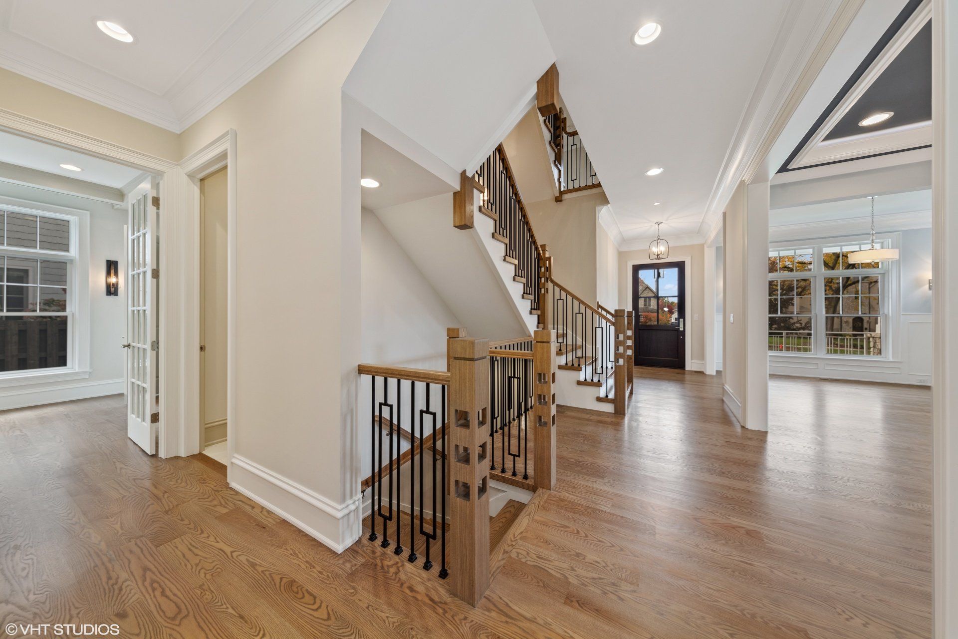 There is a staircase in the middle of the hallway.