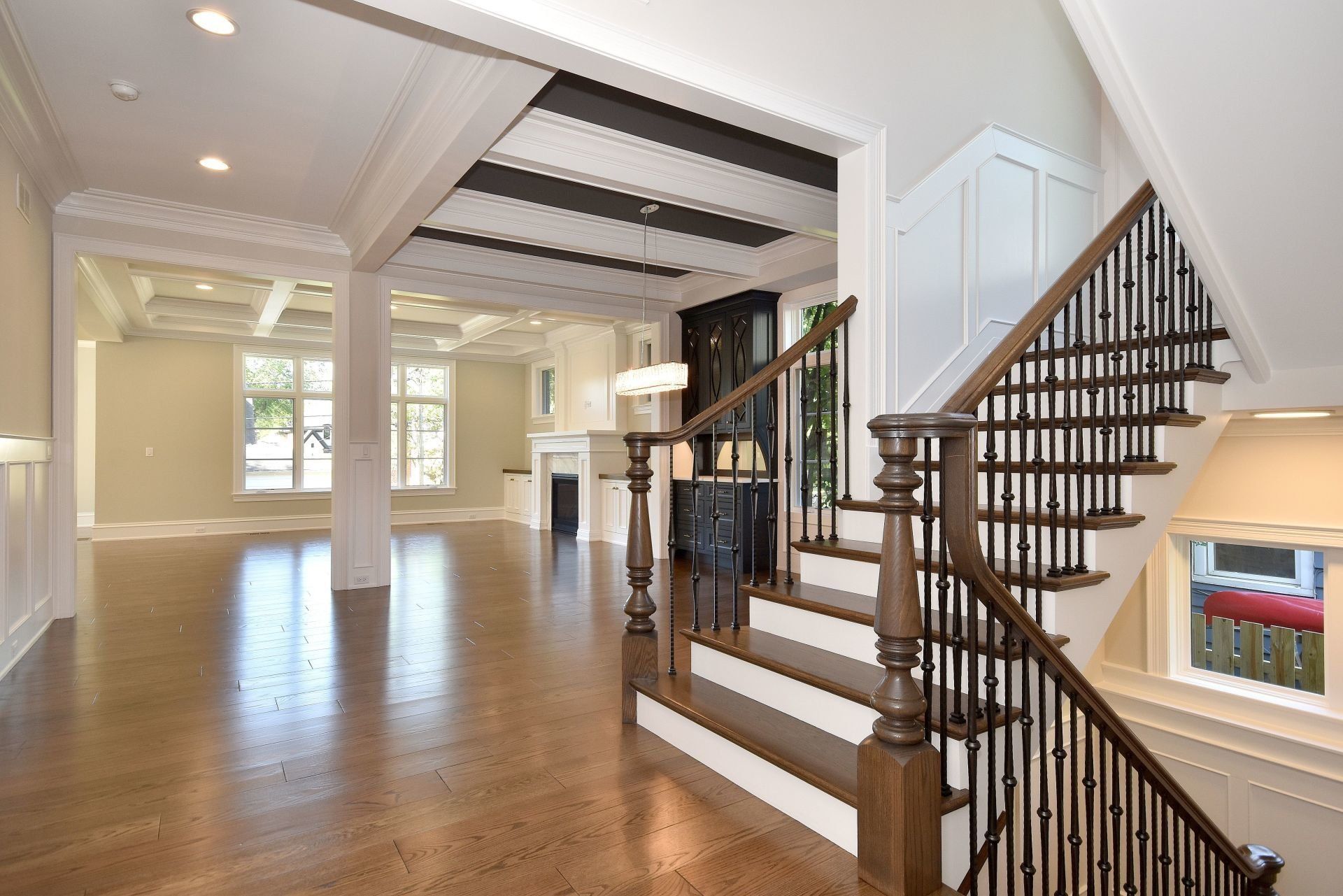 An empty house with stairs leading up to the second floor