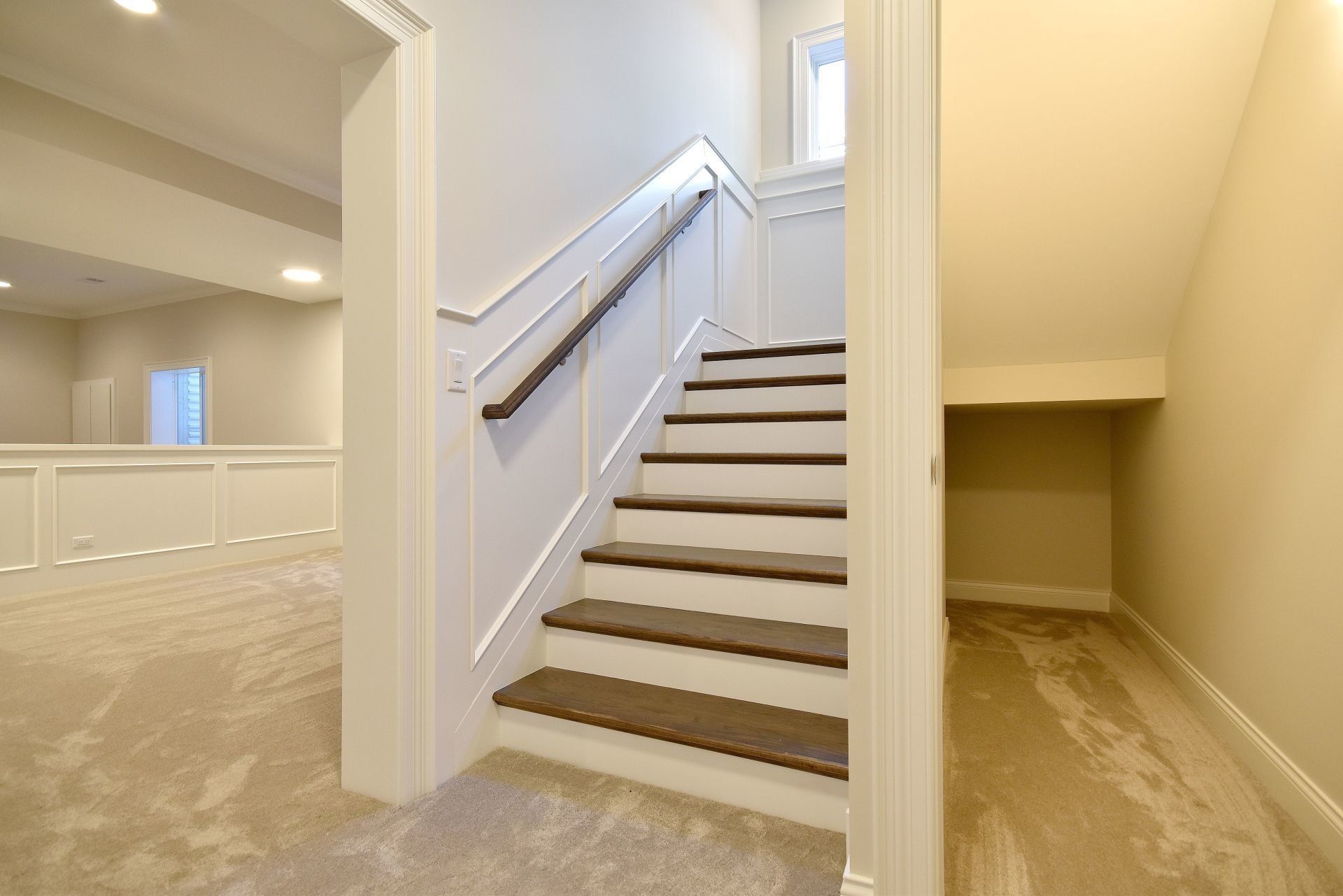 A set of stairs leading up to the second floor of a house.