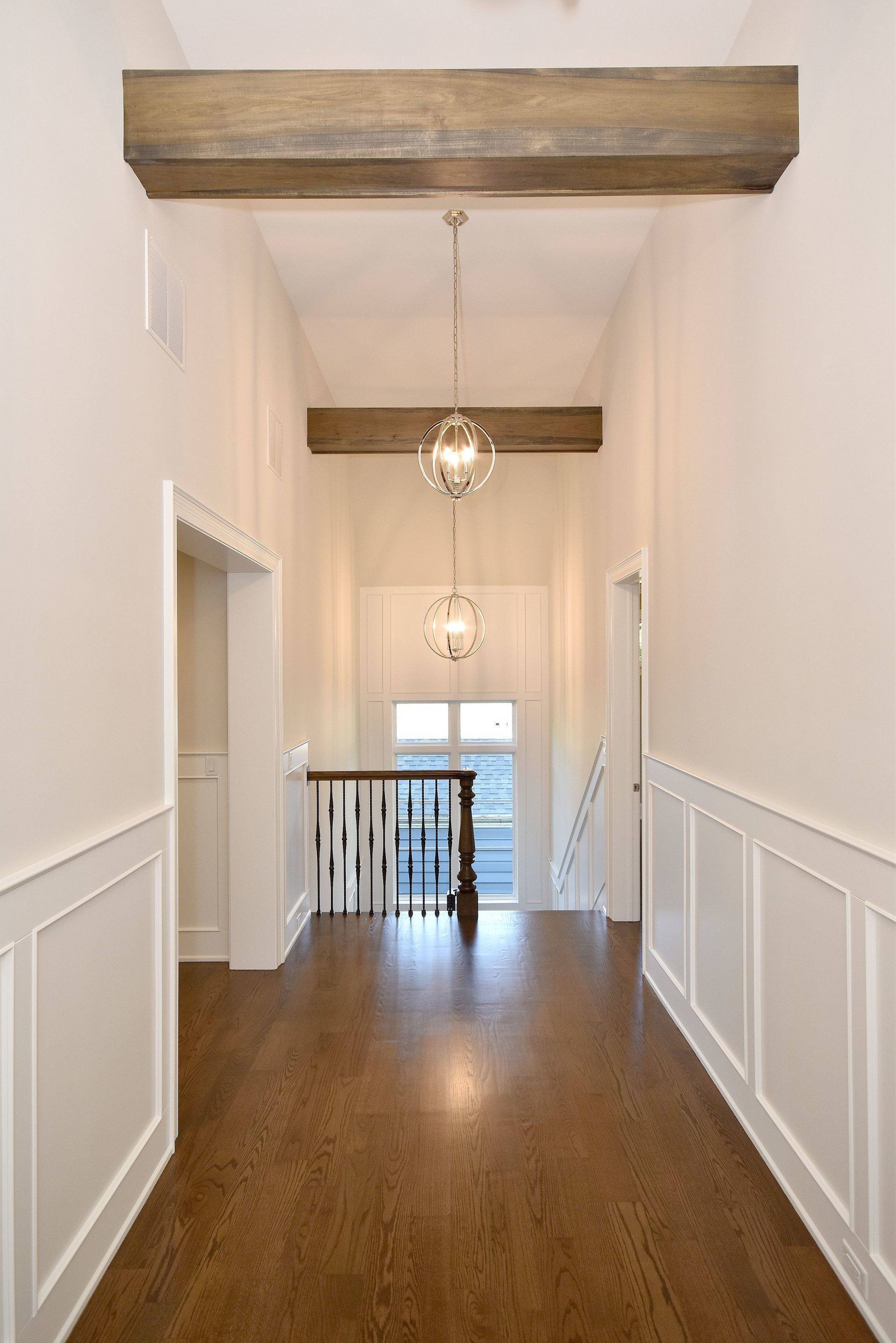 There is a staircase in the middle of the hallway.