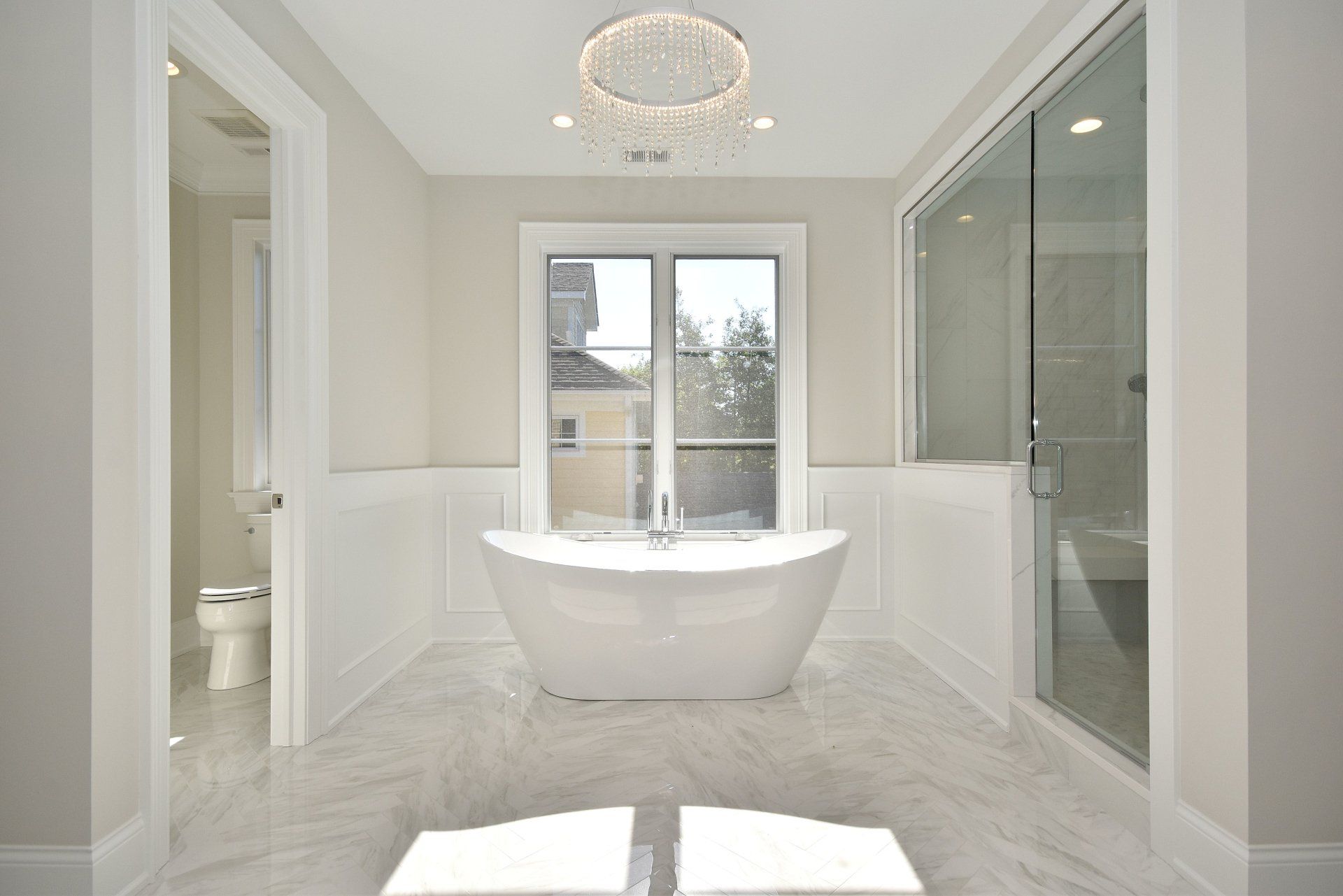 There is a bathtub in the middle of the bathroom.