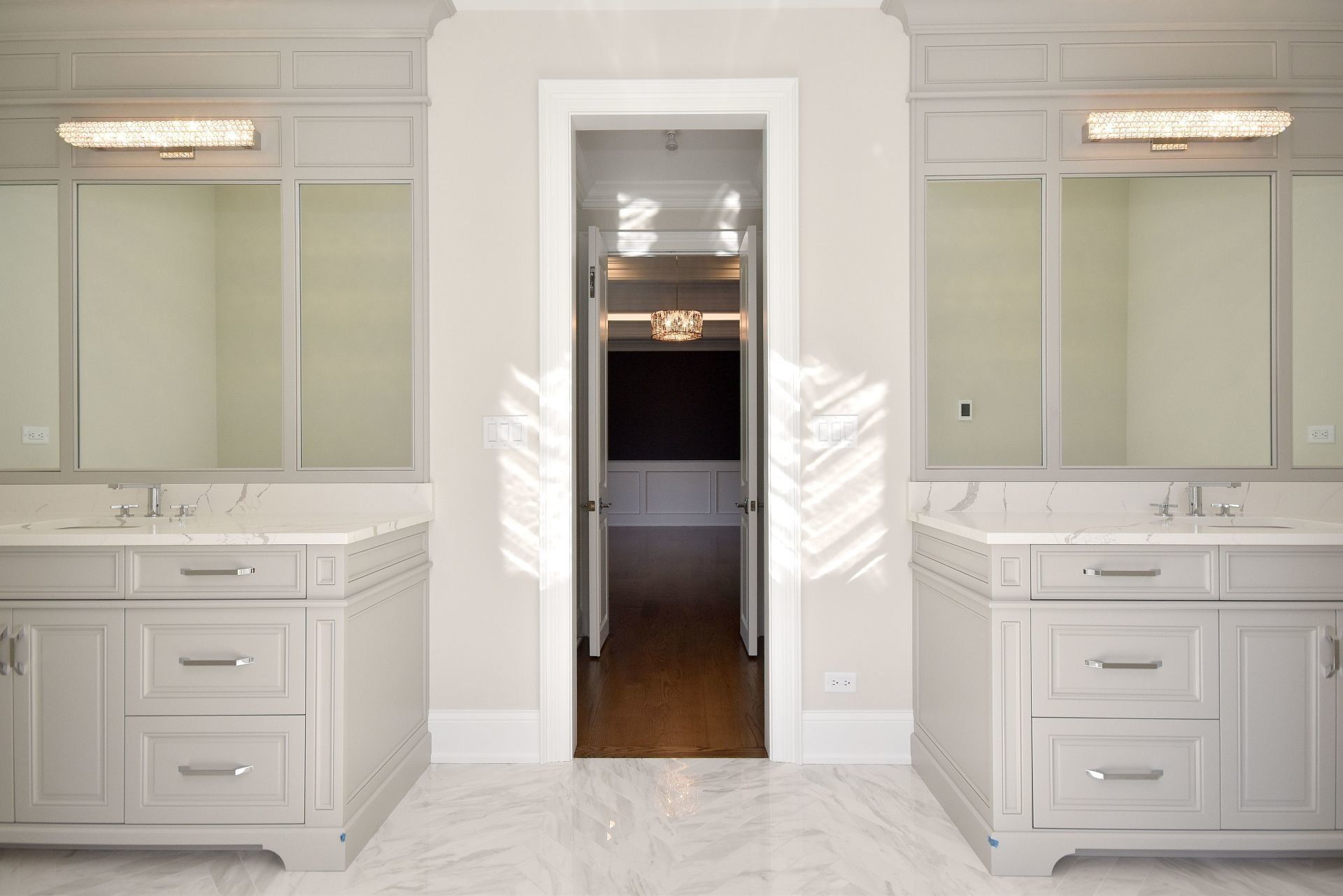 A bathroom with two sinks and two mirrors.