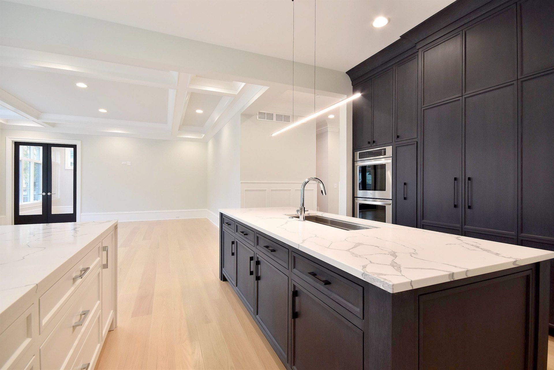 There is a large island in the middle of the kitchen.