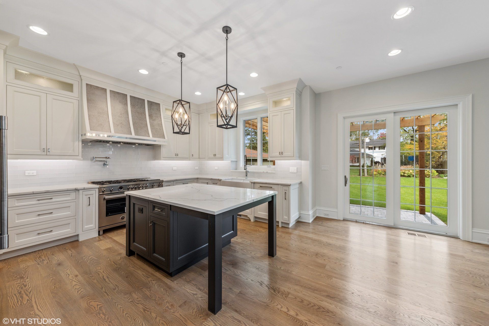 There is a large island in the middle of the kitchen.