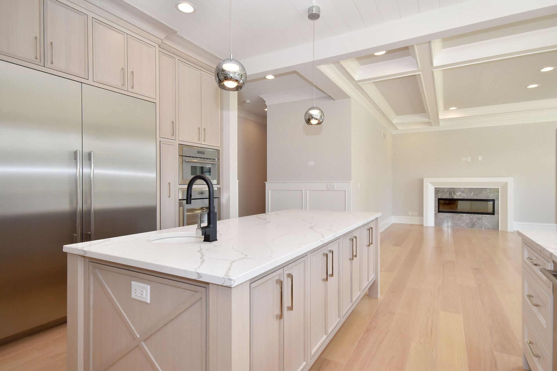 There is a large island in the middle of the kitchen.