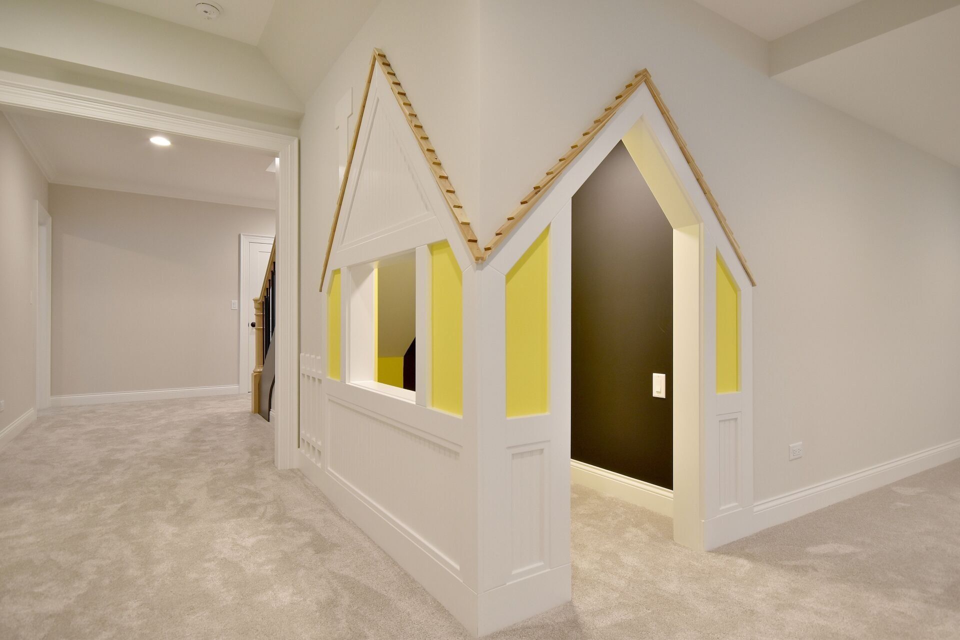 A hallway with a door that looks like a house