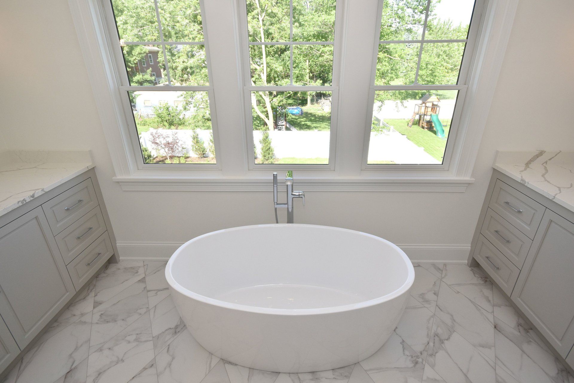 There is a bathtub in the middle of the bathroom.