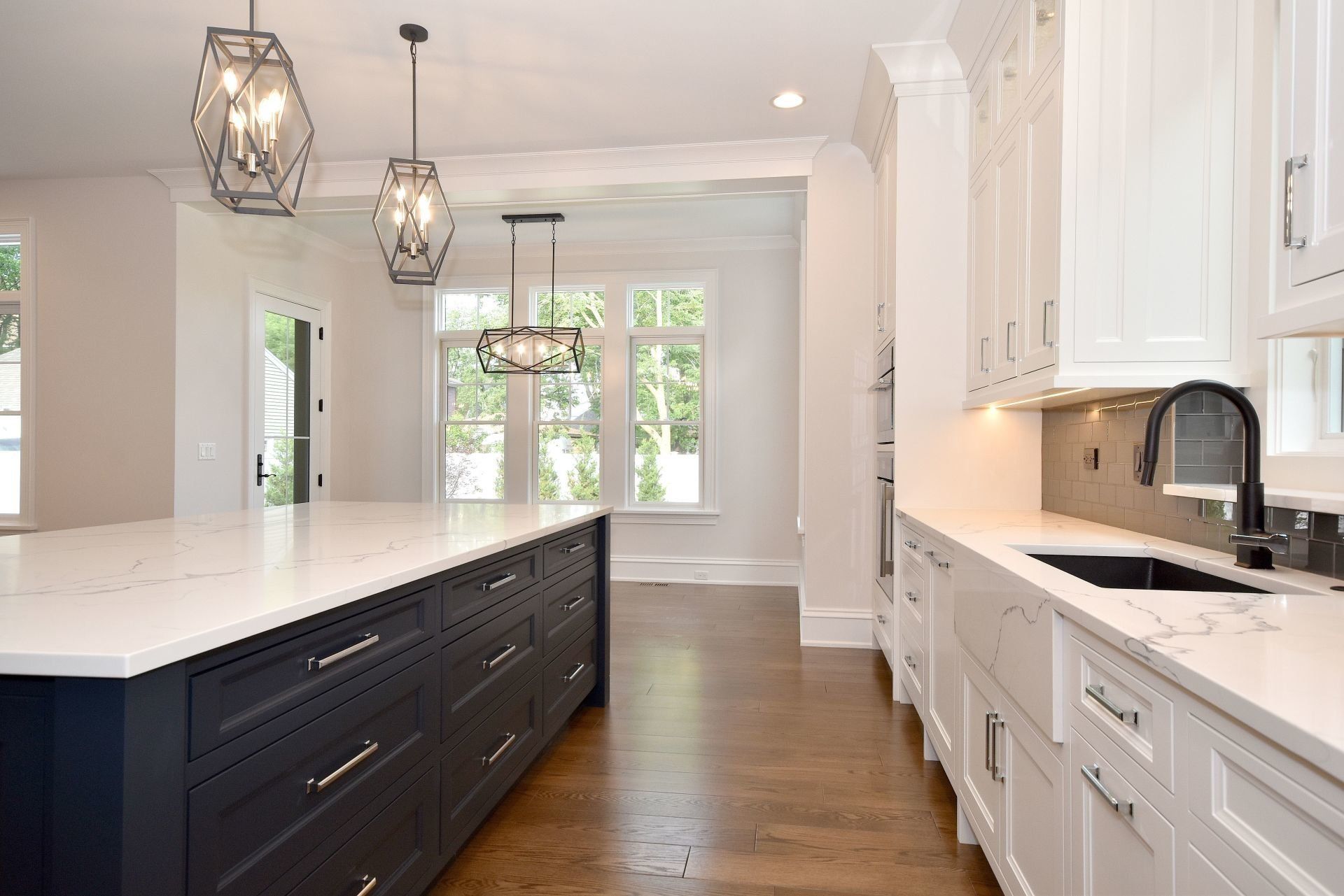 There is a large island in the middle of the kitchen.