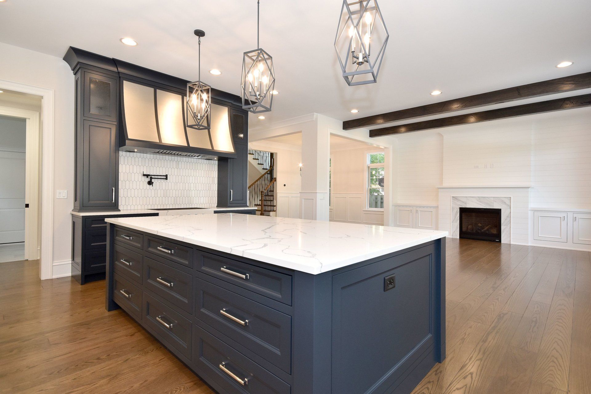 A kitchen with a large island in the middle of it