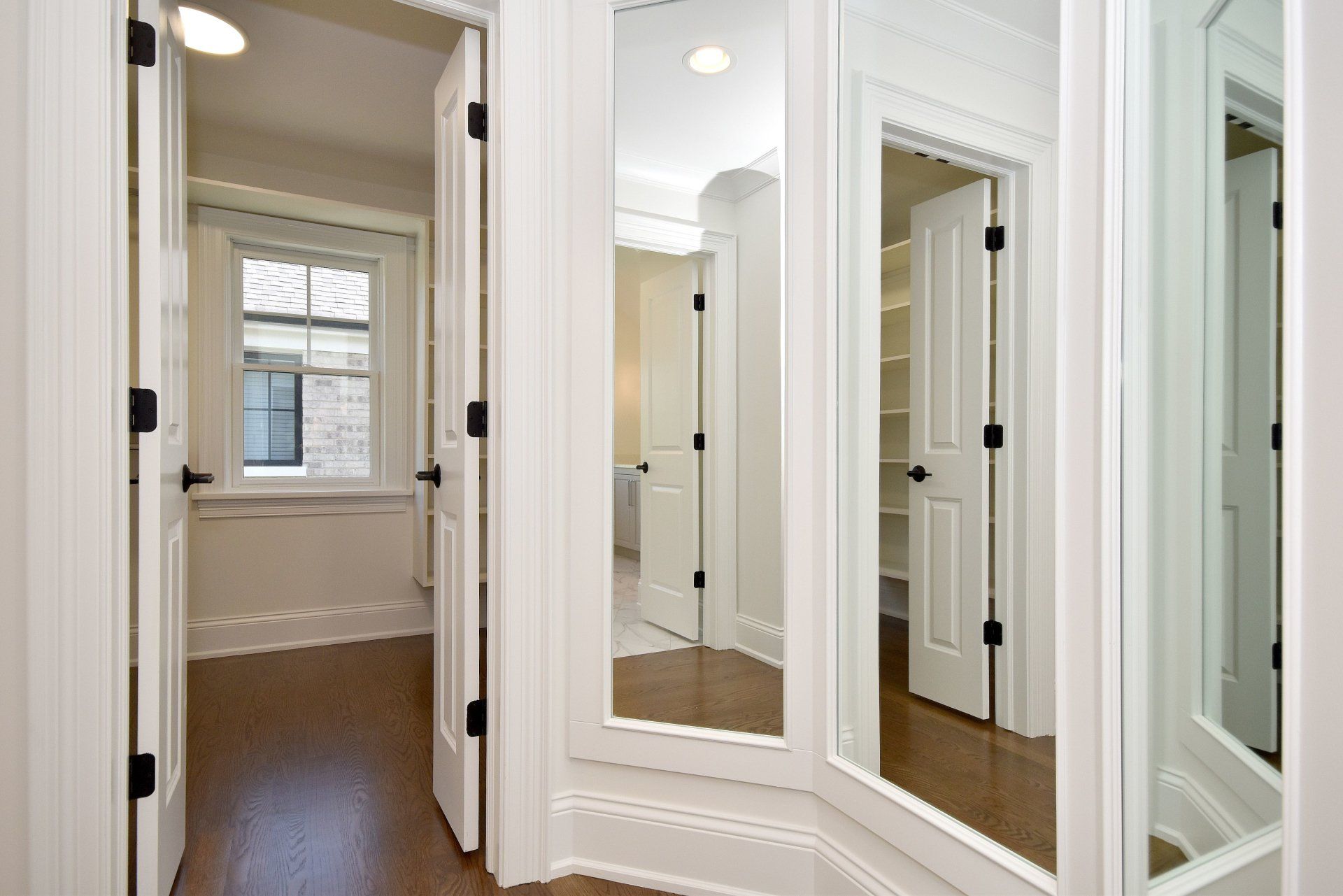A hallway with a lot of mirrors on the wall