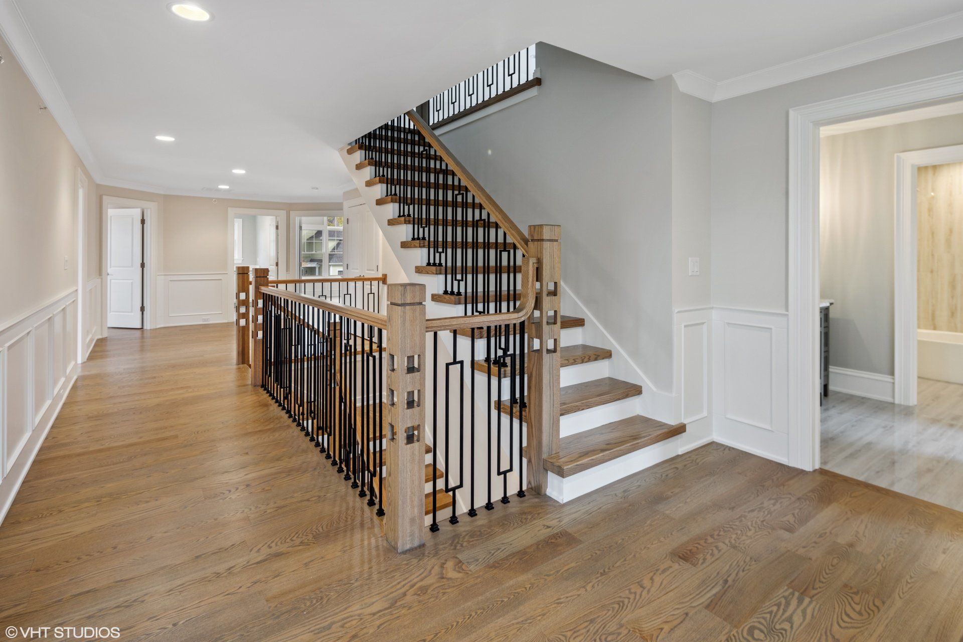 There is a staircase in the middle of the hallway.