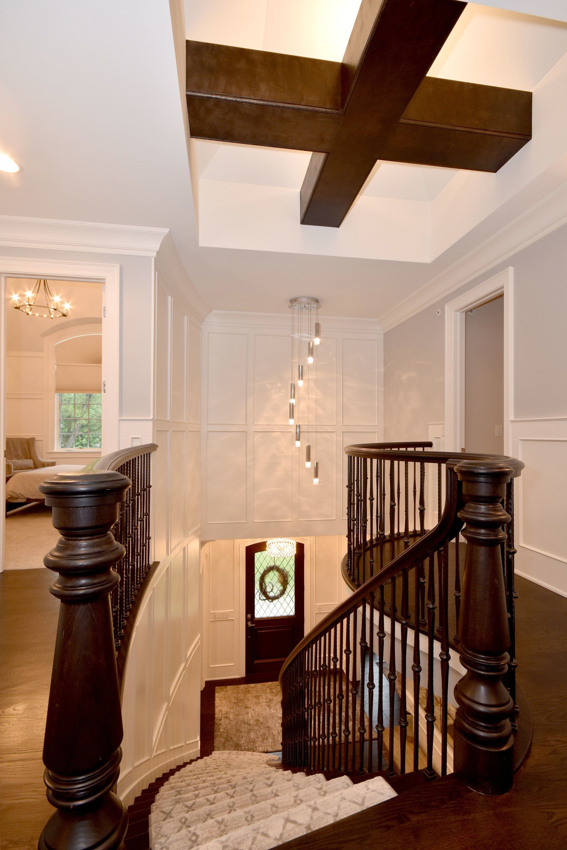 A spiral staircase leading up to the second floor of a house