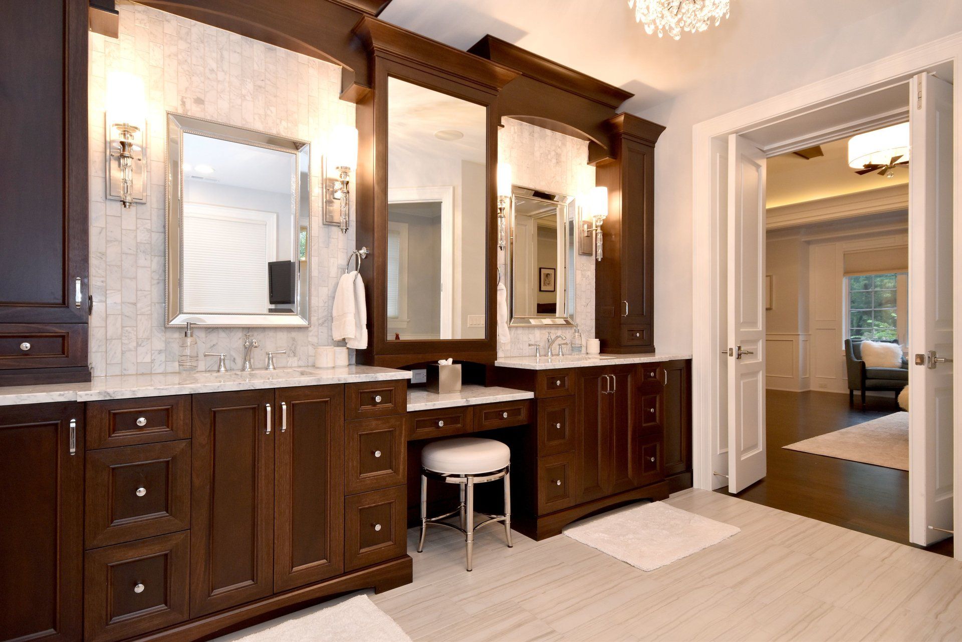 A bathroom with two sinks and two mirrors