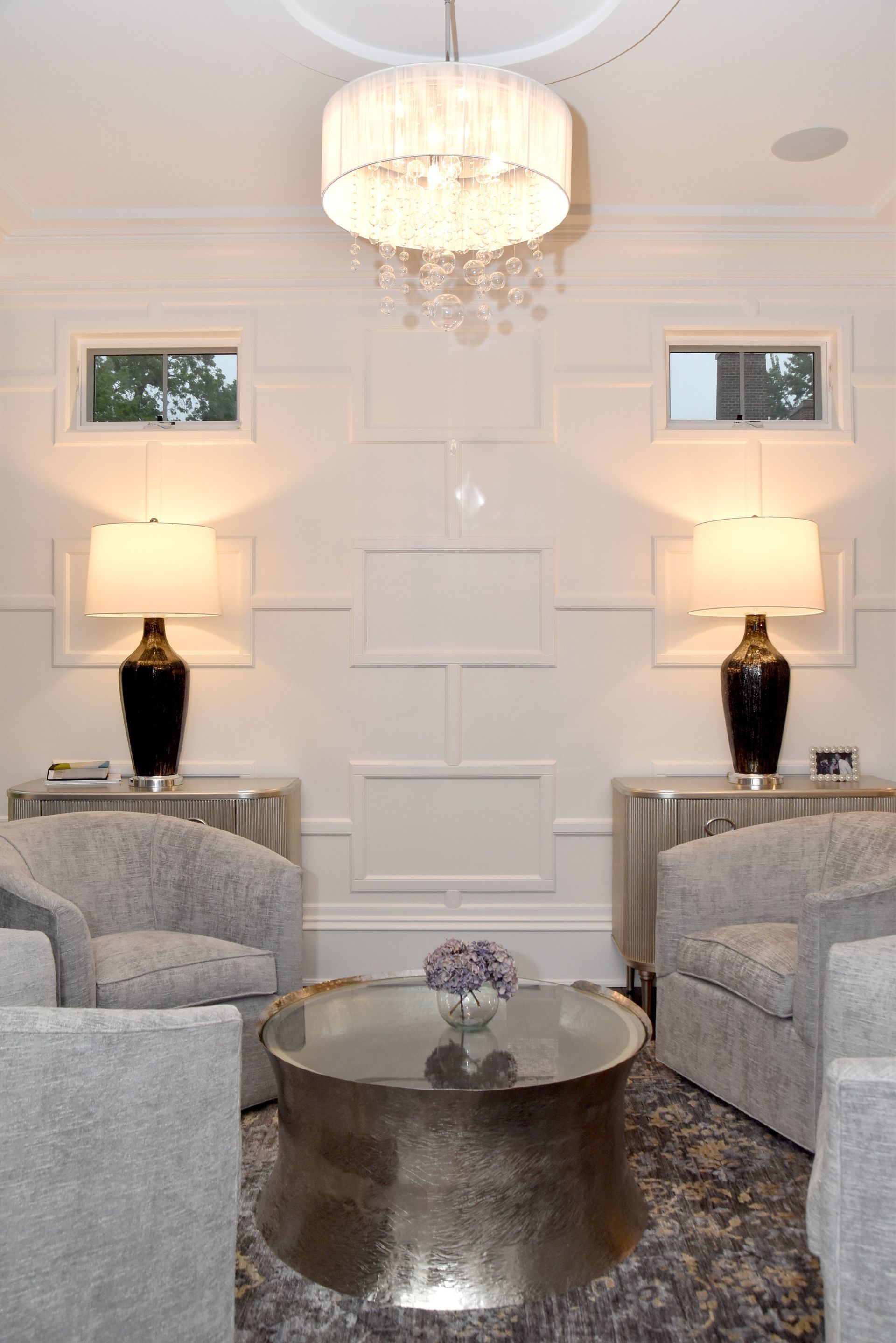 A living room with two chairs and a coffee table