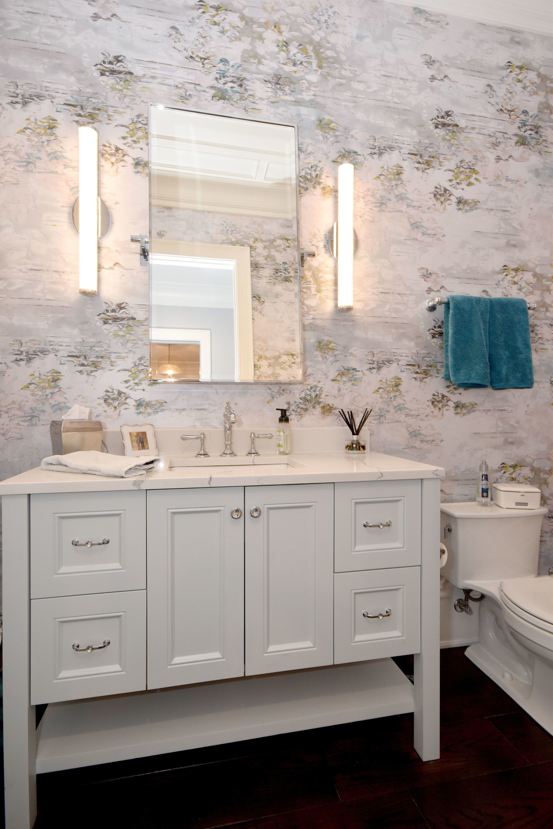 A bathroom with a sink , toilet , and mirror