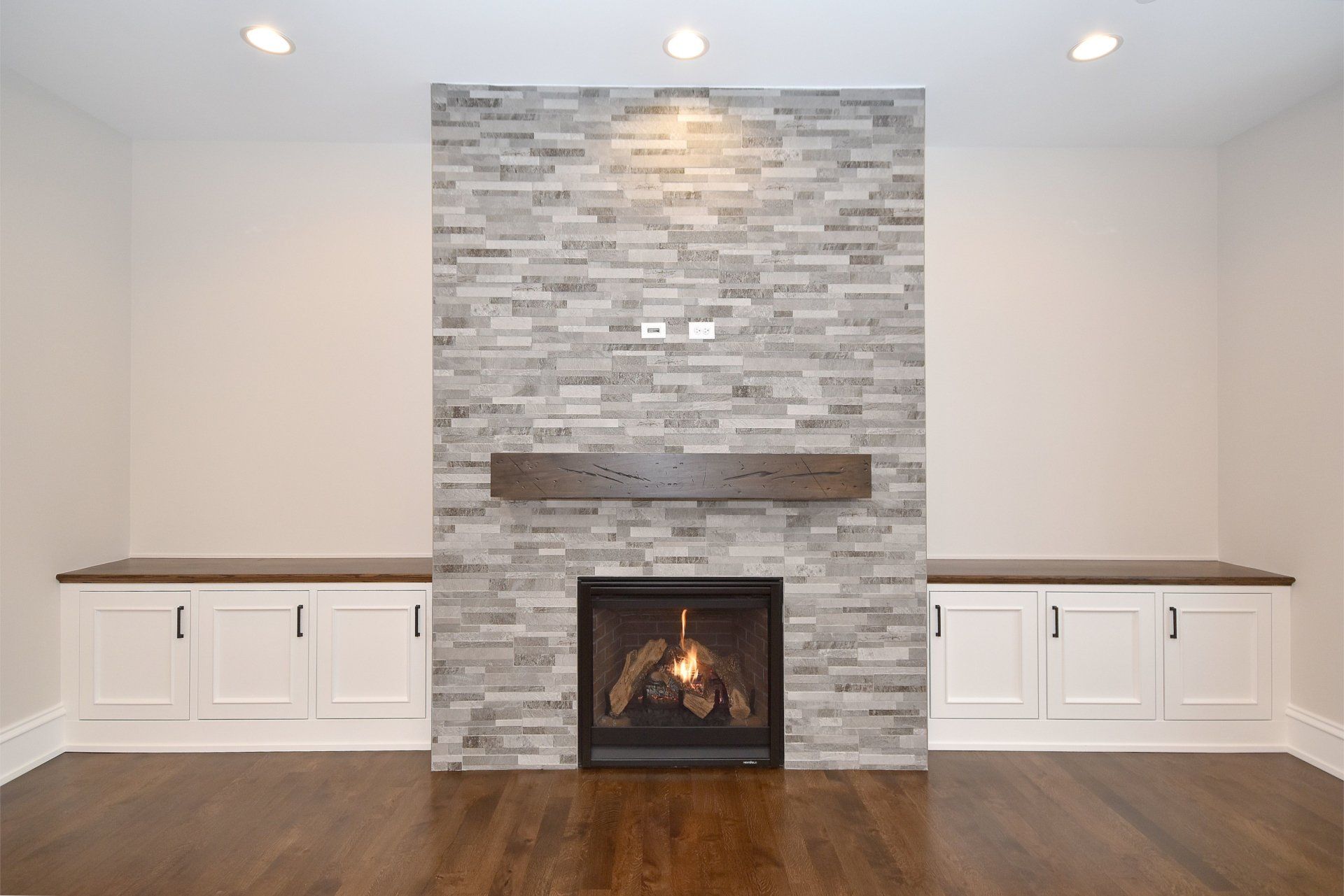 There is a fireplace in the middle of the room.