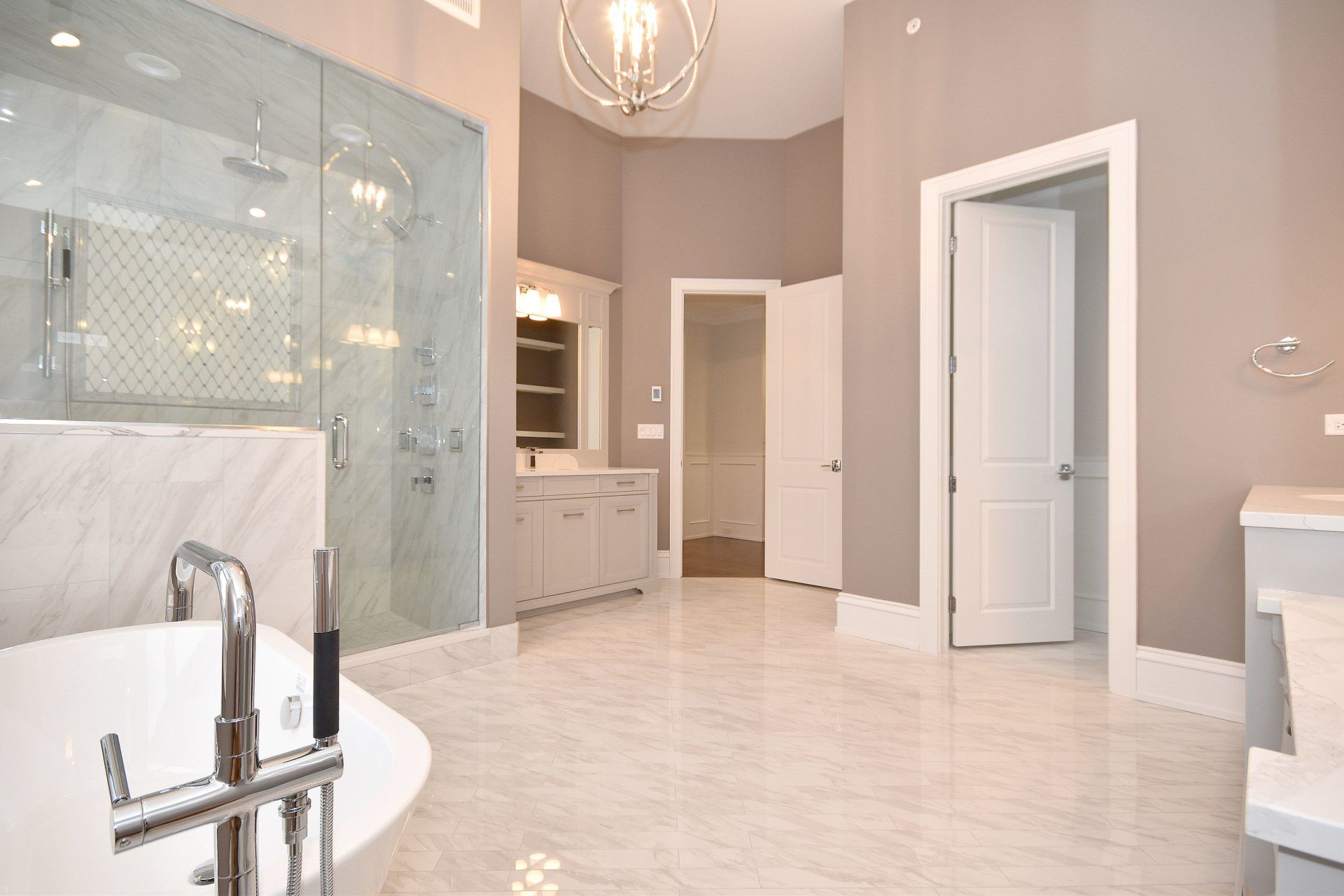 A bathroom with a bathtub and a walk in shower.