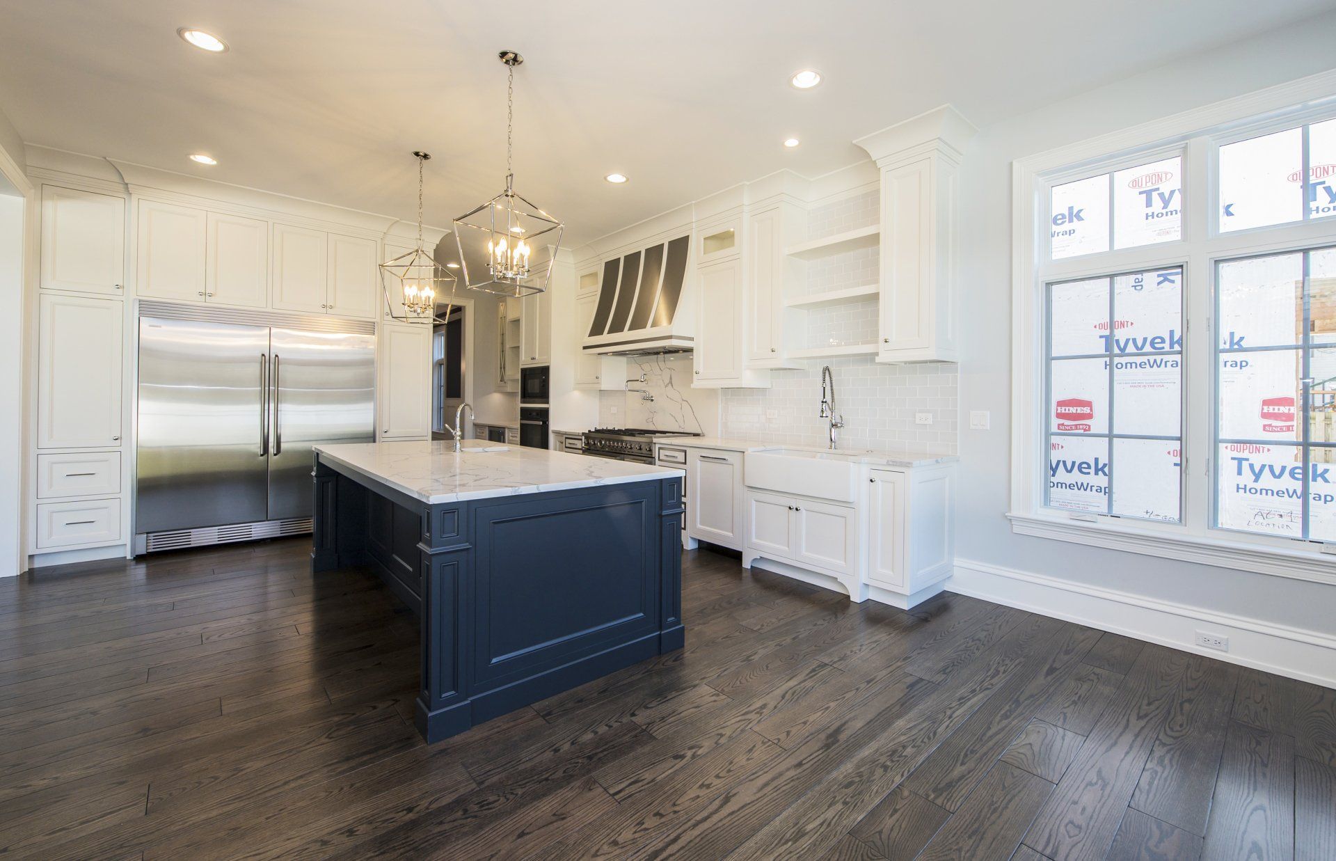There is a large island in the middle of the kitchen.