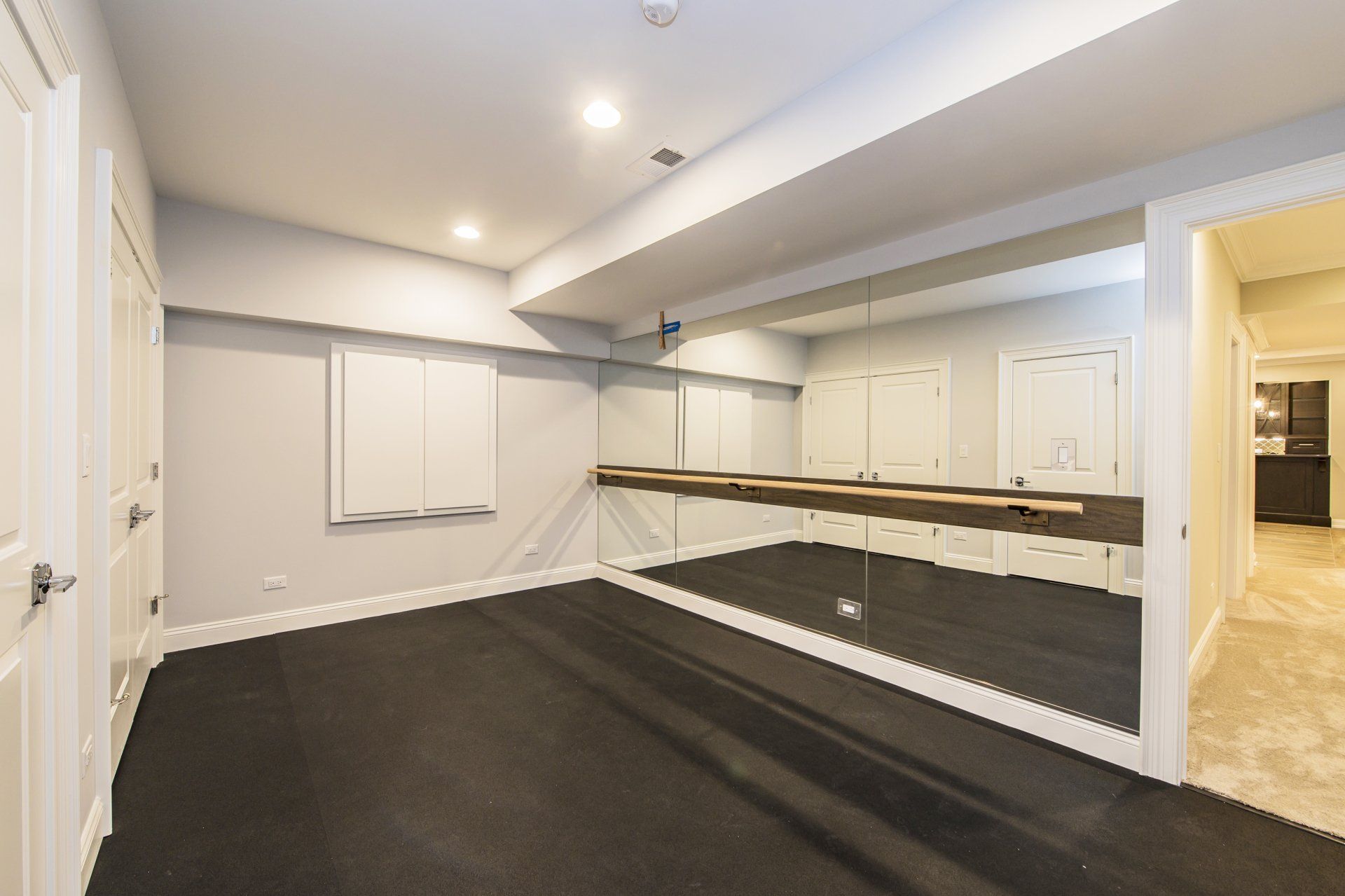 There is a large mirror in the middle of the room.