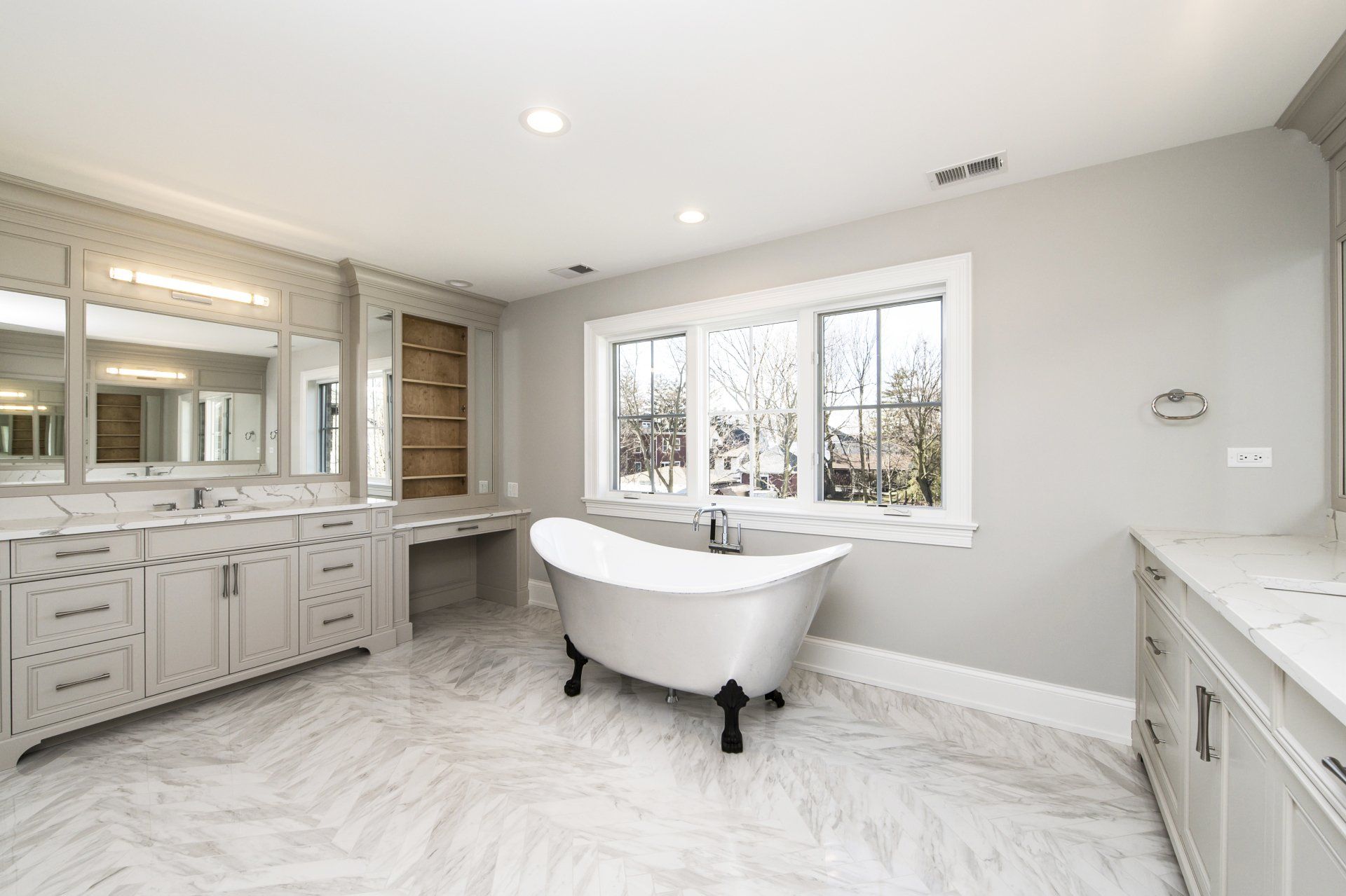 There is a bathtub in the middle of the bathroom.