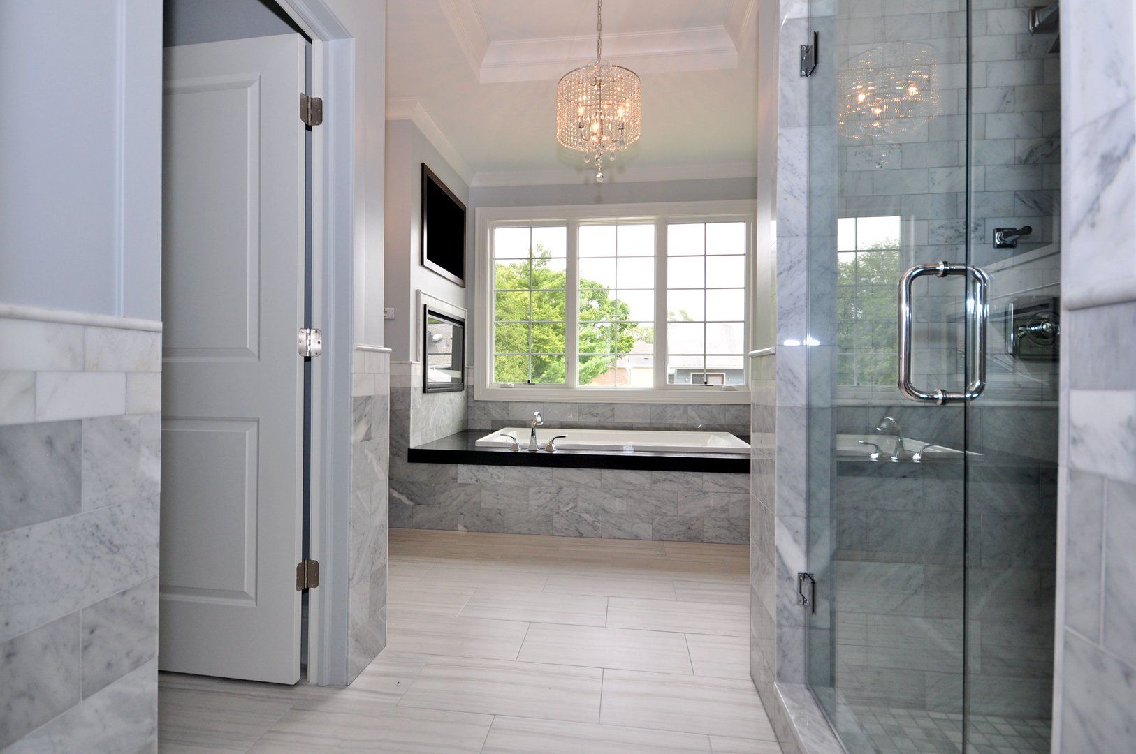 A bathroom with a tub and a walk in shower