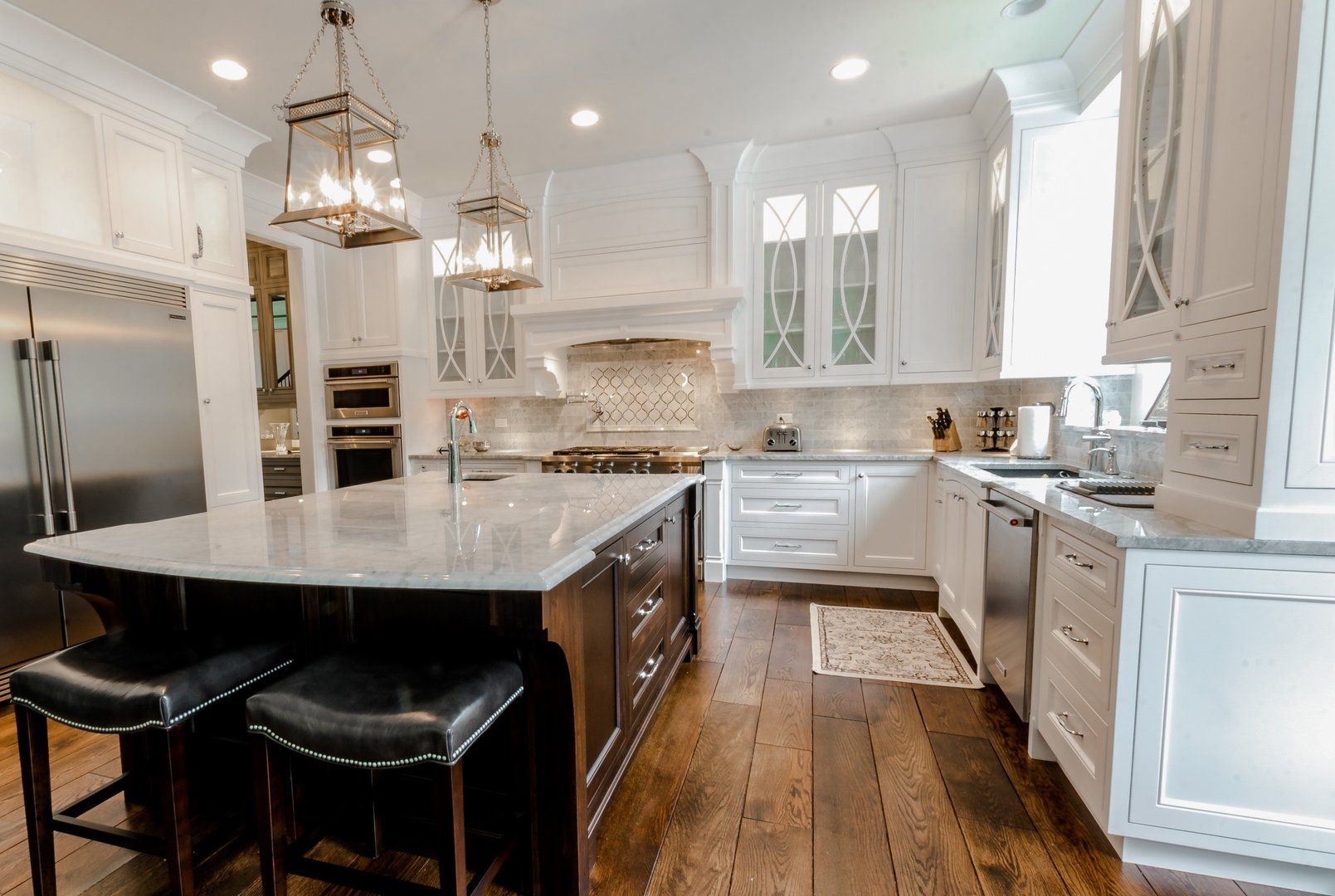 There is a large island in the middle of the kitchen.