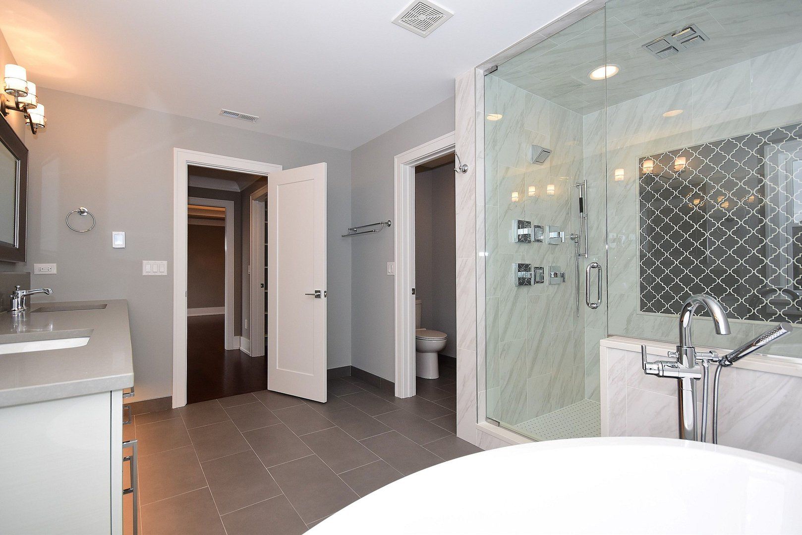 A bathroom with a bathtub and a walk in shower