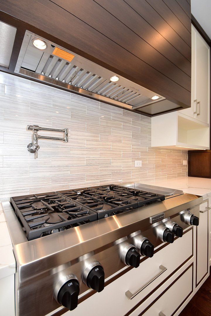 A stainless steel stove top oven in a kitchen