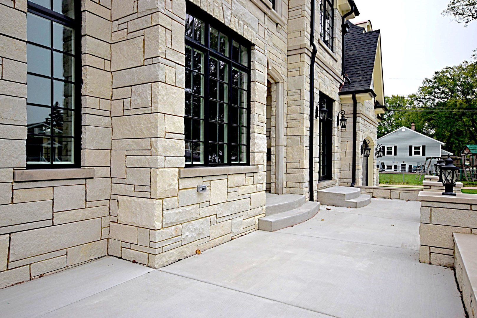 A large brick building with a patio in front of it
