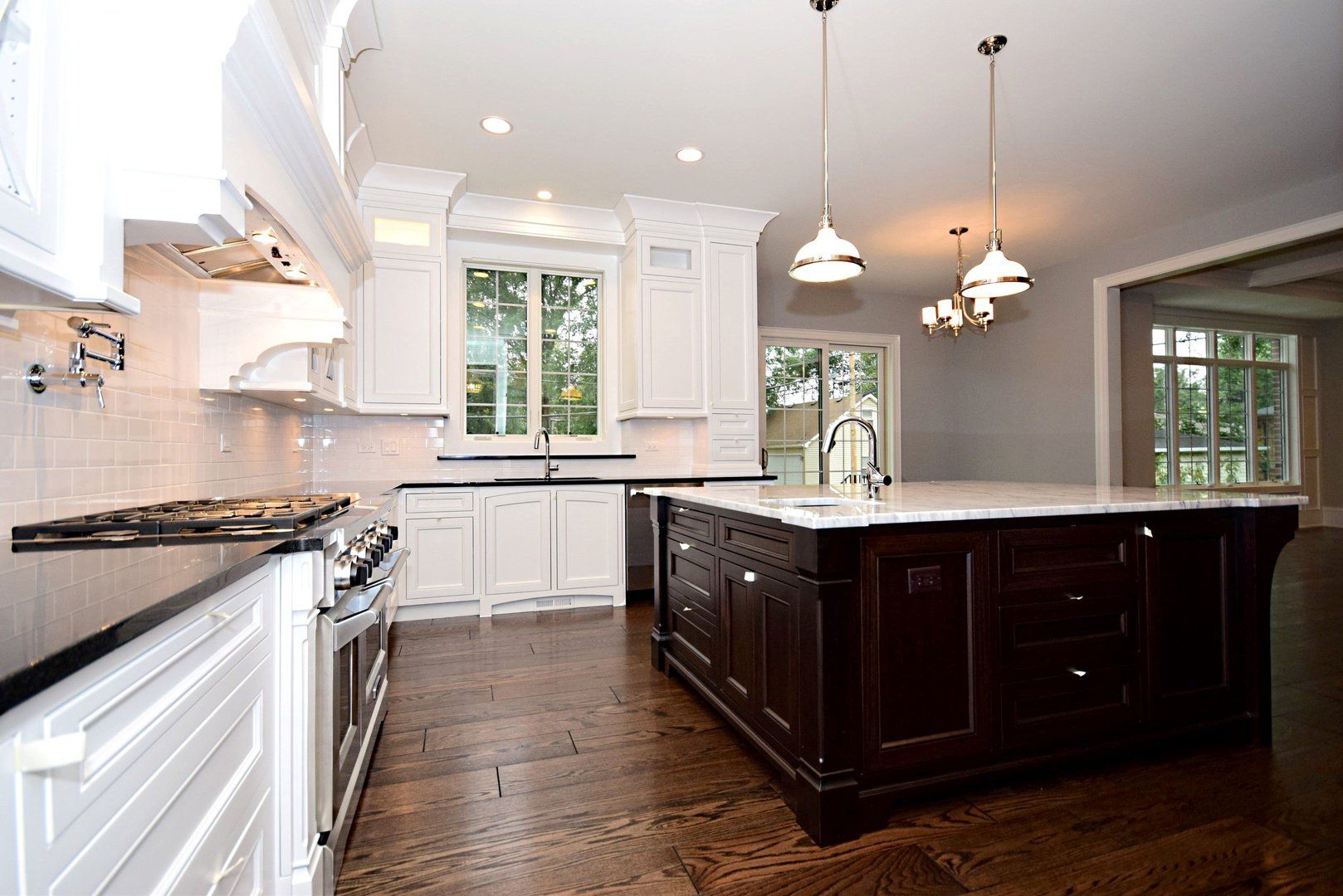 There is a large island in the middle of the kitchen.