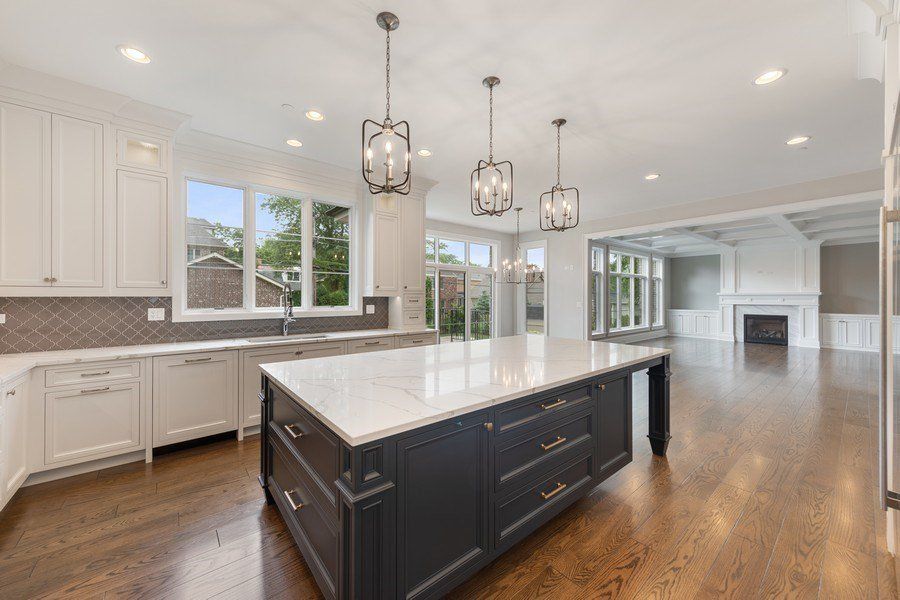 There is a large island in the middle of the kitchen.