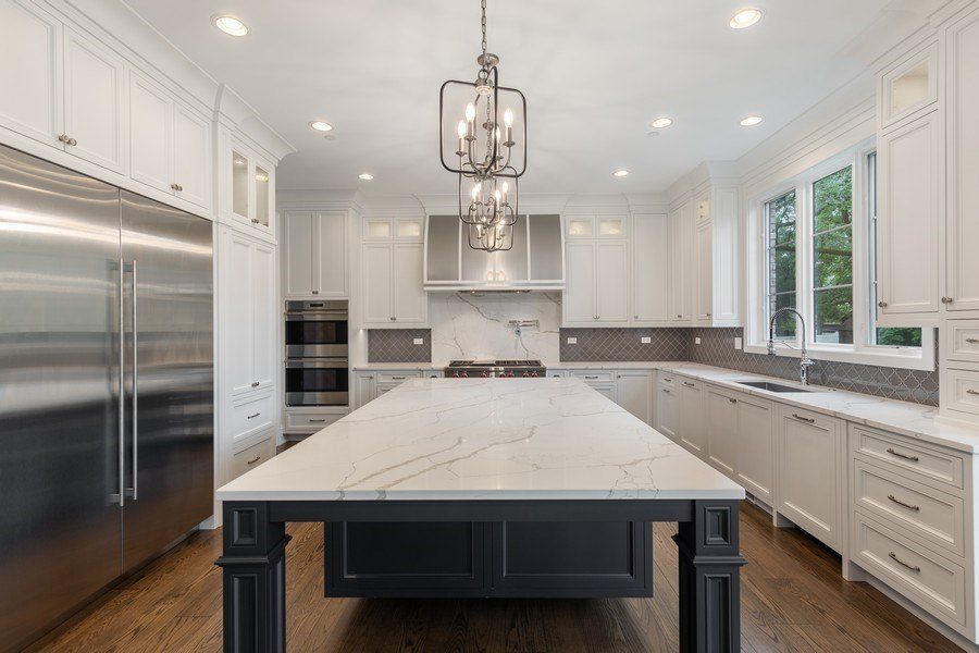 There is a large island in the middle of the kitchen.