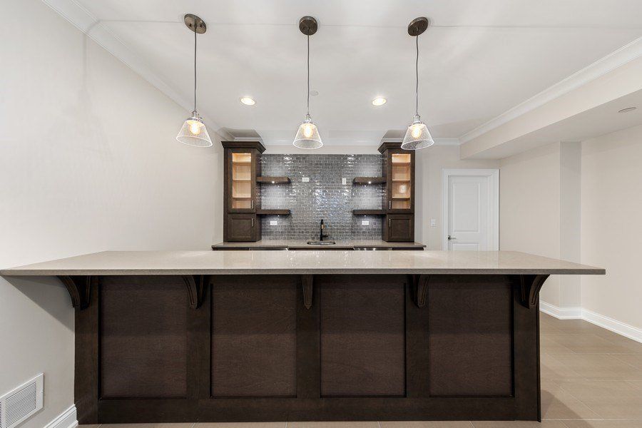 There is a large island in the middle of the room.