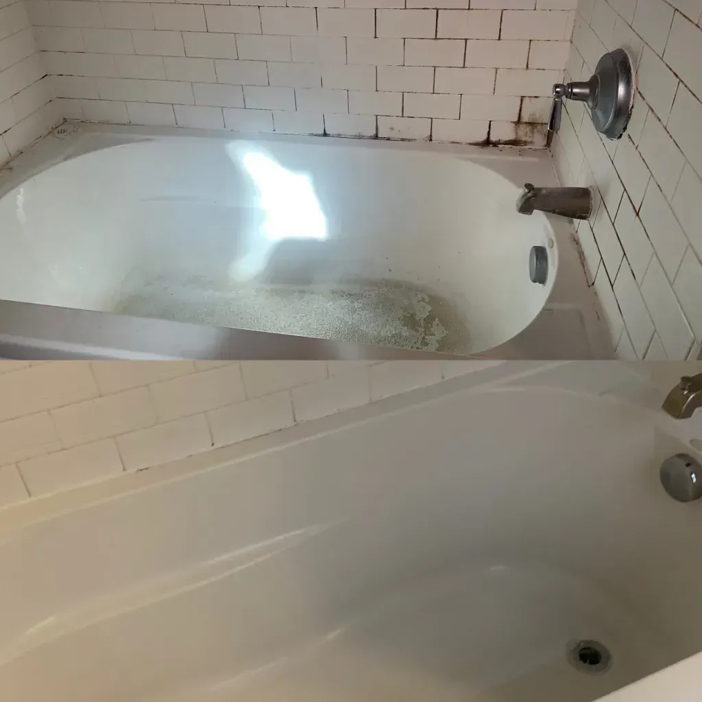 A bathtub in a bathroom with a brick wall