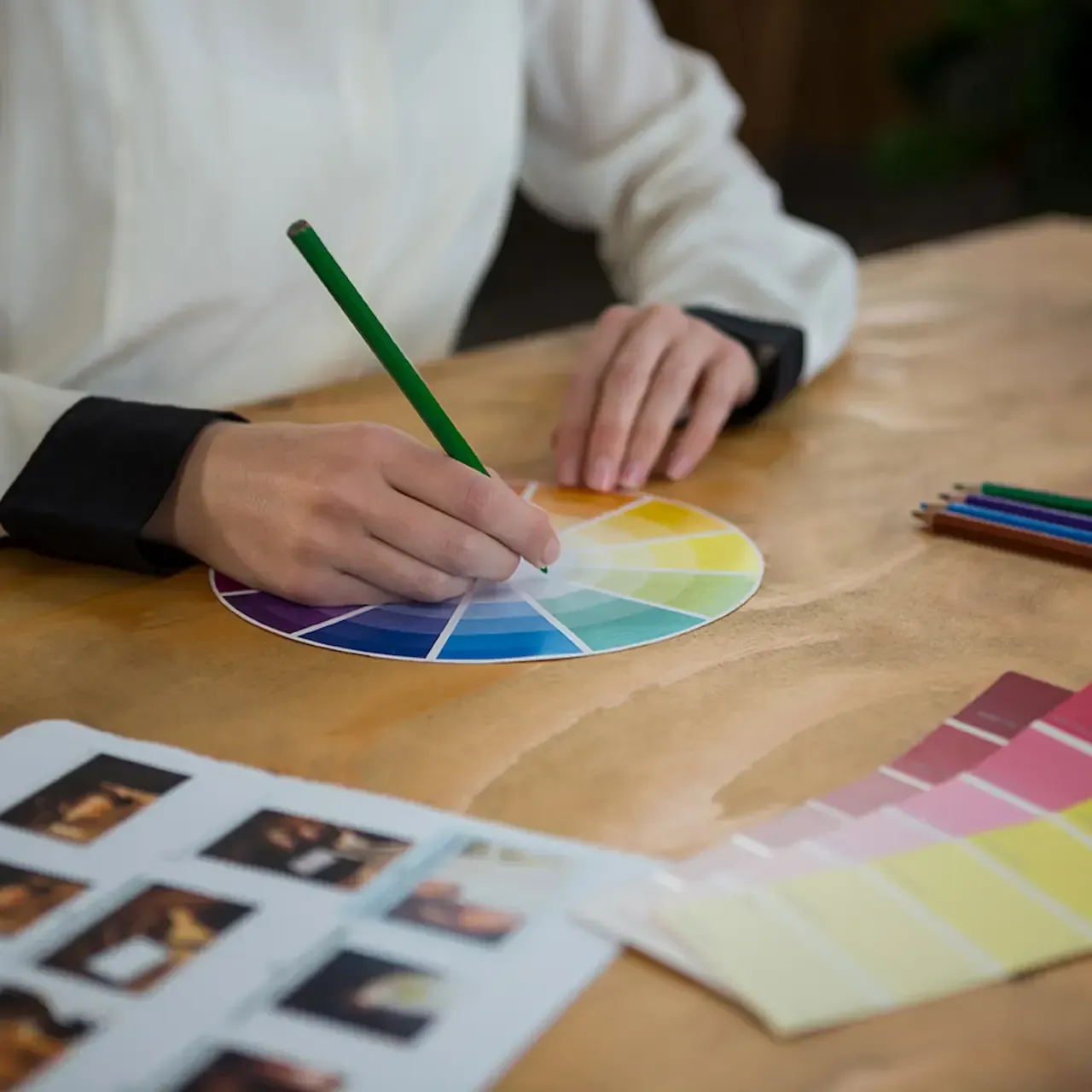 Colour management printing - person using a colour wheel for accurate colour selection and calibration