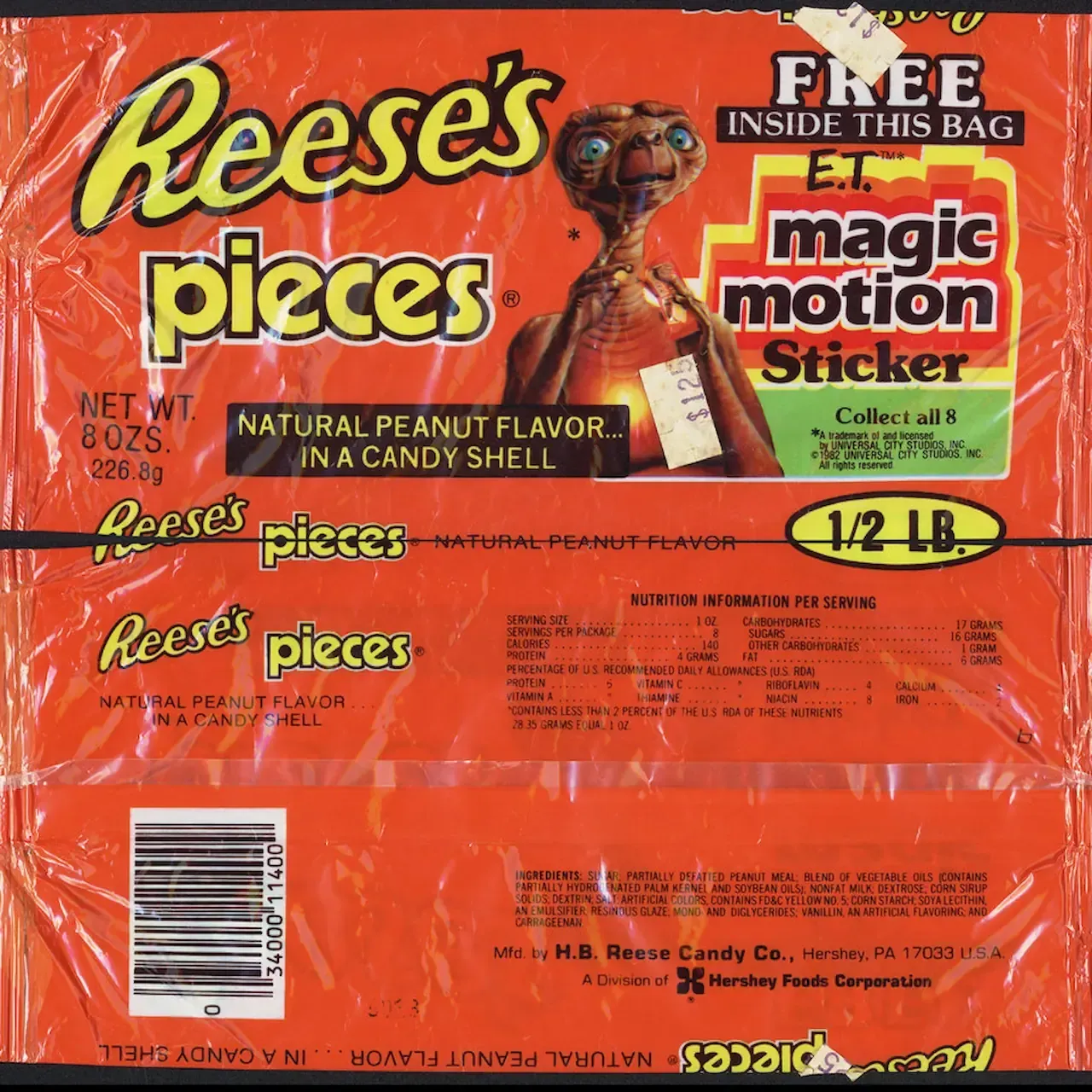 Orange Reese's Pieces candy wrapper with E.T. image and 