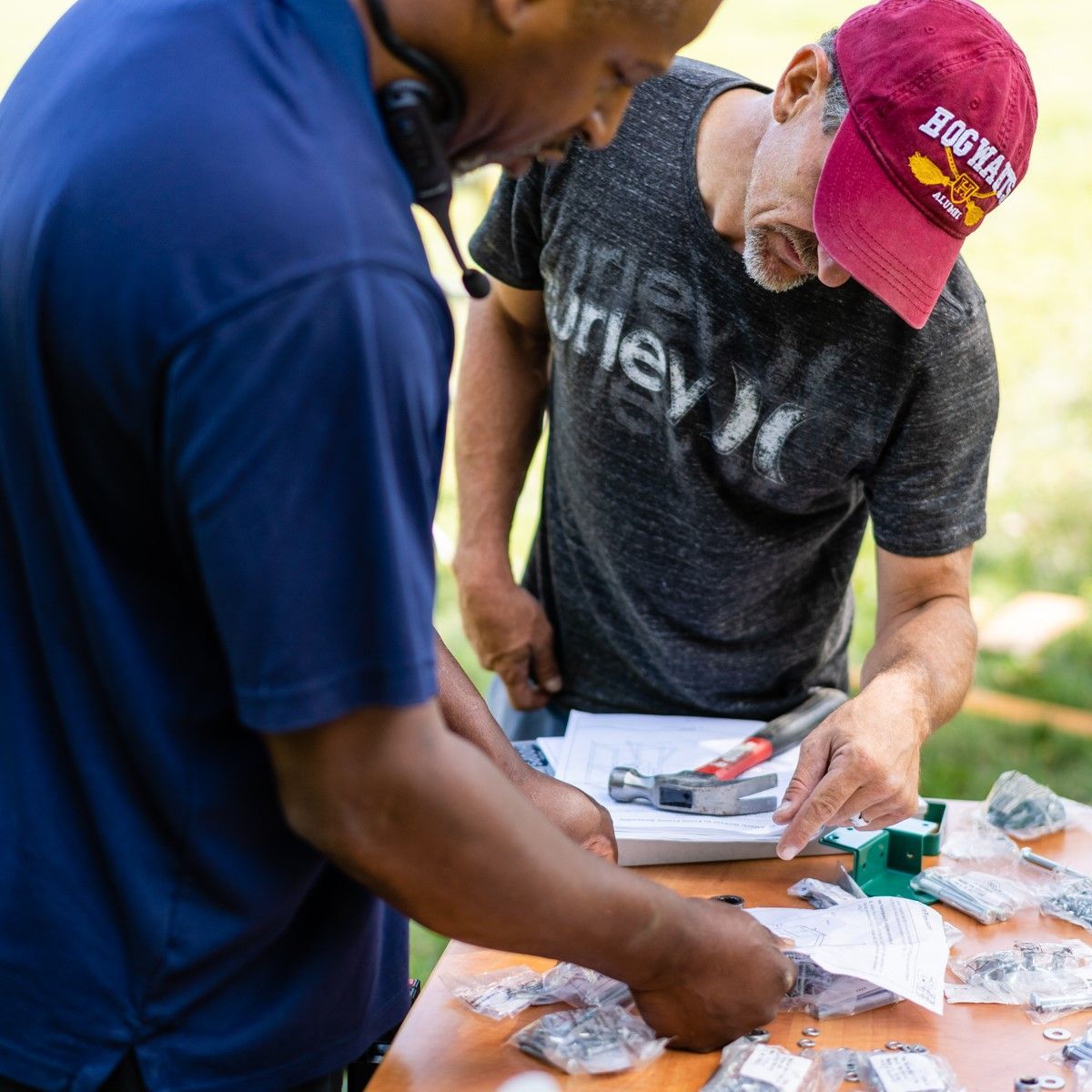 A man wearing a hat that says ' big bear ' on it