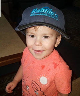 Child Wearing Ronnie's Handymand & Home Service LLC Hat