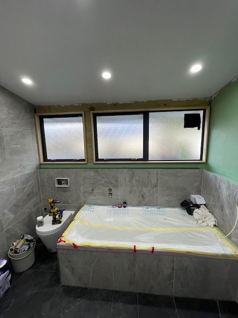 Bathroom with a Bathtub and a Toilet — Lower Hutt, NZ — Complete Aluminium Maintenance Ltd