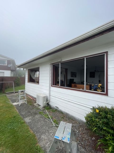 White House with a Lot of Windows and a Ladder in Front of it — Lower Hutt, NZ — Complete Aluminium Maintenance Ltd