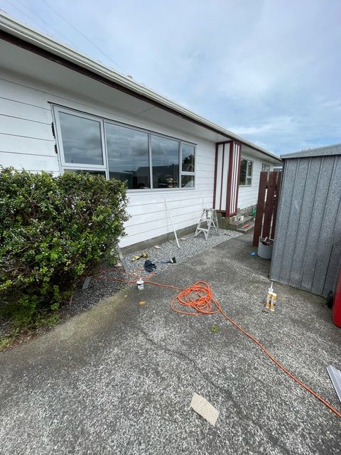 A House with a Lot of Windows is being Painted — Lower Hutt, NZ — Complete Aluminium Maintenance Ltd