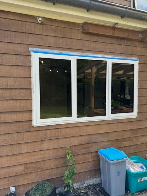A Large Window on the Side of a Wooden House — Lower Hutt, NZ — Complete Aluminium Maintenance Ltd